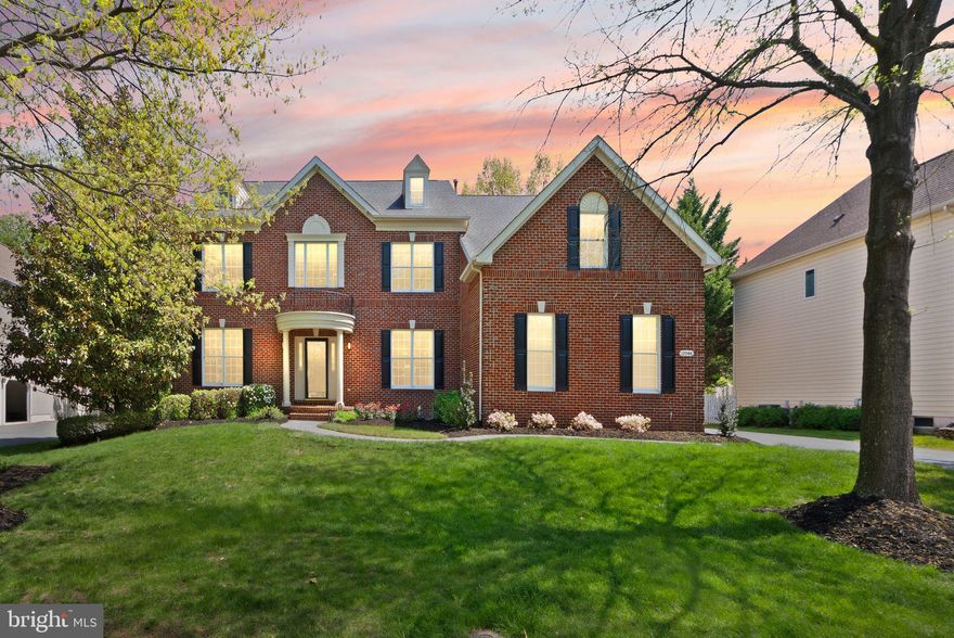 Open House Sunday April 19th 2pm - 4pm**A Rare Offering in Belmont. Set on more than a third of an acre in the prestigious Belmont Country Club gated community, this stately brick Colonial presents a rare combination of space, privacy, and resort-style amenities. Offered for the first time by its original owners, this is a property that reflects true pride of ownership, with extensive updates designed for comfort, convenience, and elevated living. A three-car side-load garage and custom portico introduce the home, opening to a two-story foyer with dramatic T-shaped stairs and refined moldings beneath a statement chandelier. Richly refinished hardwood floors run throughout the main level, connecting formal living and dining rooms that provide flexible space for entertaining and everyday relaxation. The heart of the home is a grand-scale family room with soaring ceiling heights and skylights above a gas fireplace and a wet bar. The chef’s kitchen is beautifully remodeled to feature white cabinetry, quartz countertops, a new backsplash, stainless steel appliances, wine fridge, an eat-in dining area, and a center island, with an adjoining sunroom that flows naturally out to the rear deck. A laundry room with upgraded front-loaders completes the main level. Upstairs, the primary suite lives like a private retreat, with a sitting room, tray ceiling, and an exceptionally large walk-in closet. The primary bathroom has been renovated to spa-like luxury, featuring a soaking tub, glass shower, heated floors, a smart toilet, and designer finishes. The upper level also includes a junior suite with a full bath and two additional bedrooms sharing a Jack-and-Jill bath. Downstairs, the redesigned lower level adds an expansive recreation room with a fully equipped bar and kitchen area, an exercise room with a dry/steam sauna, a cedar closet, and a nanny suite with full bath that provides comfort and privacy for guests or live-in support. An expansive unfinished area is suitable for a workshop, storage, or future customization, and a short walk-up leads directly to the exterior. Step into the backyard and imagine the possibilities: ample space to design a custom pool, room to expand, and endless potential to create your own outdoor sanctuary. The patio by the pergola is reinforced to support a large hot tub, making it easy to bring a spa‑like experience outdoors. Premium upgrades include Schonbek lighting in the dining and bathroom, EV charging in the garage, and remodels of the kitchen, primary bath, and hardwood floors within the last five years. Enjoy comfort and peace of mind with fresh interior paint and a newer roof, garage doors, and water heater. Both HVAC systems were replaced in 2021. Belmont Country Club residents enjoy an Arnold Palmer-designed 18-hole golf course, a 35,000 square foot clubhouse with Virginia-inspired architecture, multiple pools, tennis, basketball and volleyball courts, walking trails, a fitness center, playgrounds, and the historic Belmont Manor Home, along with clubhouse dining and a full calendar of social programs. High-speed internet, cable, and full lawn and landscape maintenance are included. Top-rated schools, premier shopping and dining, parks, and easy commuter access place the best of Northern Virginia just beyond the gates. A rare chance to own a meticulously maintained home in one of Loudoun County’s most established communities.