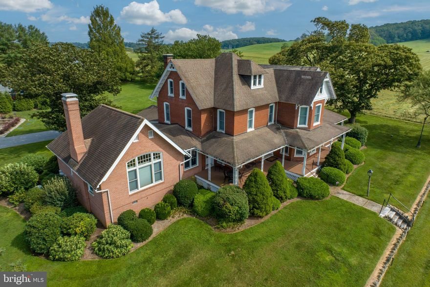 A true gem in pastoral West Marlborough Township.  Beautiful, updated and historical, this is a 4BR, 4.5 bath Manor home built in 1866 with approx. 4,900 SF living space on 1.02 acres.  Virtually every room has a commanding view of the breathtaking Doe Run valley and its hundreds of acres of conserved open space in the desirable Unionville-Chadds Ford School District.  

Walking between a low stone wall with six original hitching posts, you approach the spacious front porch running the full length of the house.  Double entry doors take you into the Center Hall with original flooring and millwork … all of which have been restored throughout the house.   On one side is the living room and on the opposite side, both via double pocket doors, is the dining room with original built in cabinetry.  The kitchen has stainless / black appliances including an almost new 4 door refrigerator/freezer, Viking electric cooktop, double oven.  A large wood paneled elevator off the kitchen takes you from the basement to the attic.  The other end of the kitchen is open to a breakfast area and beautiful family room with custom cabinetry, including a wood burning fireplace, built-in office area, window benches and entertainment center.  A PR, mud/pantry room and stackable w/d lead to the attached 2-car garage.  Completing the first floor is a MBR that includes another w/d.  

The second floor has two en-suite bedrooms with wall-to-wall carpeting and built-in closets, plus a third bedroom and bath.  A sitting room enjoys even wider views of the lush pastures and incredible vistas.  

The home has had massive renovations since acquired in 1985 on all fronts.  The basement is clean, with extra wide wood doors, a well-organized physical plant, two oil tanks and a sub-basement.  This was used by the original owner for storing produce and even includes an inoperable dumb waiter from the basement to the 2nd floor.  Wide granite stairs lead to a double door outside access.  The attic is clean with built-in open storage shelving galore.  Attic access is via the elevator or as backup, a carpeted stairway.

New well installed in 2018 with water conditioning, UV and reverse osmosis systems.  On-site septic, along with a shared state-of-the-art Drip Irrigation system.  For safety and security, a security system centrally monitored, house generator and house surge protection on each electric panel is provided.  The home is very peaceful thanks to the original brick being 3 courses thick and Anderson A-series windows installed from 1st floor to the attic.  Most all windowsills are granite or marble.

The exterior offers a ramp encased in brick and custom ironwork from the garage/drive to the family room door or to the mud/pantry room door.  All exterior house fixtures are from Ball & Ball.

24 hour notice required for showings.  Please do not drive into the property without an appointment.