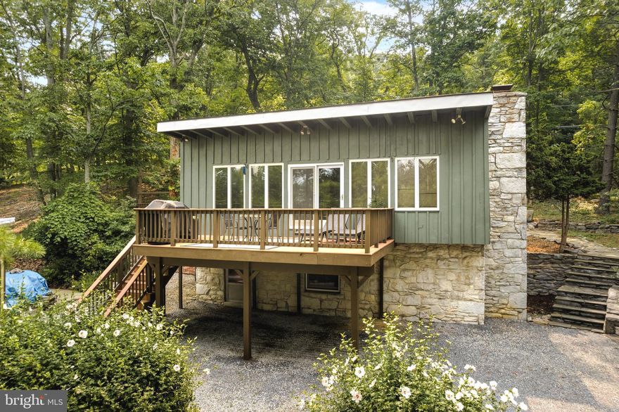 SELLER HAS OFFERS IN HAND - Escape away to your own retreat in Shannondale, Harpers Ferry WV where you can enjoy being immersed by nature full-time, part-time, or as an investment/ air bnb! Stunning Stonework Details, Woodbeams, plus Ample indoor and outdoor entertaining and relaxation space - this property has the best of both worlds offering Character and Charm + Updates and Modern Conveniences. This 1800+ sqft home will not disappoint you! Main Level offers a welcoming Foyer, Large Family Room, Dining Area, * Newer Trek Deck is accessible from your Family Room and Dining Area to watch evening Sunsets, Spacious Kitchen w/ plenty of Countertop space and cabinets + built-ins. Just remodeled Full Bathroom w/ double Sinks, and walk in shower, Large Bathroom w/ 2 closets, and access to private deck. The lower walk out Level offers a Large 2nd Family Room, Full bathroom, Laundry/ Mudroom, and ample amount of storage!
A large Storage Shed, Playground Set, and Cement Patio can also be found on this OVER acre corner lot.

Energy Efficient Home, High-Speed Internet,  All Paved Roads + Driveway.
NO HOA! Mountain Lake Club Bar and Grill, River County Store, Shenandoah River Access, 

Recent Upgrades - New Metal Roof + Added Insulation (2019), New HVAC (2019), New Hot Water Heater (May 2021), Tree work done around the property (Nov 2021), Beautifully Remodel Full Bathroom (3/2023)

SELLER HAS OFFERS IN HAND - CALLING FOR HIGHEST AND BEST BY 5PM SATURDAY JULY 22 2023