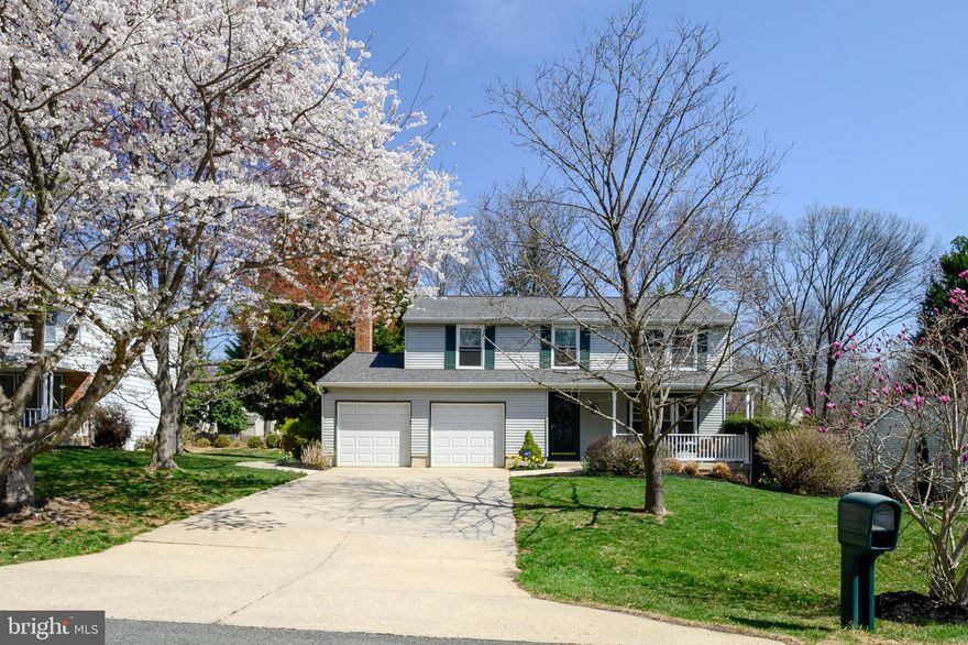 ****OFFER DEADLINE**** Monday 4/7/25 at 5 pm.  Welcome to this charming home, located on a peaceful cul-de-sac on a beautiful, private lot.  As you approach, a welcoming front porch invites you into the home.  Inside, this beautifully maintained 4 bedroom, 2.5 bath home features an upgraded kitchen with lovely cabinetry accented by crown molding, under cabinet lighting, a stylist backsplash, and plenty of cabinet space.  The kitchen and family room open onto a spacious sunroom with adjoining deck and built-in hot tub, creating the ideal space for both relaxation and entertaining.  The family room features hardwood flooring, a gas fireplace (with remote) that is flanked by upgraded and decorative built-in cabinets, with French doors that flow seamlessly into the sunroom - one of the home's most outstanding features! This bright space is perfect for reading a book, enjoying quiet afternoons, or hosting guests.  The spacious living room and dining room, both feature beautiful hardwood flooring.   Upstairs, you'll find four generously sized bedrooms, including a bright primary suite with a walk-in closet and a beautiful en-suite bath with double vanities.  One of the bedrooms is currently a den/office with built-in shelving and there is a brand-new hallway bath/shower.  This home also features a large crawl space with moisture barrier and climate control, plenty of parking including a two-car garage (garage doors can be operated from anywhere in the world, using a phone app.), a lovely concrete walkway that leads you to a fully fenced yard, complete with a brick paver area designed for a fire pit.   The roof was replaced in 2024, and there's a very low HOA fee of only $84 a year!  Don't miss out on this exceptional property that has been meticulously maintained!