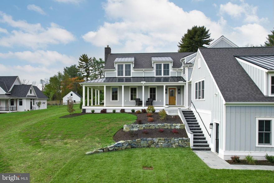 Designed by award-winning John Milner Architects in Chadds Ford, this impressive 5 bed, 3 full & 1 half bath Custom home incorporates Country farmhouse open floor plans & beautifully designed rooms & extraordinary craftsmanship. Walk the beautifully designed flagstone pathway to step into the large sun filled foyer & you are greeted by natural hardwood wide plank flooring& neutral wall pallets. The formal dining room off the entryway hall is highlighted by a stunning modern farmhouse chandelier while the spacious family room boasts an oversized gas fireplace and beautifully crafted custom wood trim mantel and surround. 2 sets of large French doors off the fireplace lead to a charming side porch made of Mahogany decking.   The beautiful porch area welcomes you with spectacular views of the Brandywine Valley. The spacious primary suite, located on the first level, offers a charming sitting area, vaulted ceiling & Closet By Design large walk-in closets, & beautifully appointed ensuite bath with quartz double sink vanities, an inviting soaking tub, bright white Corian stall shower & exquisite radian heated floors. Just off the dining room is the stunning gourmet kitchen, highlighted by high-end finishes including two-tone dark walnut & simply white floor to ceiling wood shaker-style cabinetry by St. Martin, a quartz backsplash, GE Café stainless steel appliances including a 48” gas range with 6 burners, double oven & griddle along with a wine fridge that make this a dream for any Gourmet Chef.   Gather around the expansive center island with striking quartz countertops and beautiful pendant lighting & enjoy family dinners around the table in the eat-in kitchen dining area. The large walk-in pantry just off the kitchen offers plenty of additional cabinetry for storage & quartz countertop space with gorgeous open wood beam shelving above, perfect for your coffee corner. The first floor also offers a laundry room with upgraded GE washer & dryer. Access to the back Mahogany deck area through the kitchen & enjoy the outdoors with plenty of space in the rear yard for outdoor activities.   The gas fireplace will keep you warm on the chilly Chester County Evening.  You will greatly appreciate the convenient mudroom just off the kitchen, complete with a tiled bathtub for bathing family pets or cleaning off dirt covered shoes after spending time outdoors. As you climb the grand staircase, you are welcomed to the second level with ample natural lighting coming through the double-hung Anderson Windows.  The second level offers 4 bedrooms, each with plenty of closet space. The larger of the bedrooms offers a full bath with gorgeous tiled floors and stall shower.  A beautifully finished hall bath with quartz double sink vanities and stall shower is shared by the remaining bedrooms.  This second level is also home to an Additional Laundry Area.   This level is finished off with lovely sitting area with gorgeous views that could potentially be a work area. This home offers privacy all around. Relax on the charming porches or entertain family & friends on the rear covered deck with an all-seasons outdoor TV & cozy gas fireplace. Beautifully designed & newly installed hardscaping & extensive landscaping with a 2-tier boulder wall in front & at the side of the home are being completed now. Oversized 2-car garage offers extra storage & has an electric car hookup. This new home completed in the spring of 2023 used some of the existing foundation of the previous building, taxes remain low, $12k in total! 3 new HVAC zones, 2 tankless hot water heaters, energy efficient Anderson windows & doors, gas line for grill, rough in for generator & James Hardi-Board Plank Exteriors. Located in award-winning Unionville Chadds Ford SD. Minutes from Kennett Sq, WC & Media, Tax Free DE shopping &  historical Brandywine Valley! Whether you are looking for the privacy of a country home or to be in the heart of
it all, this home has it all!  Come see this today!!