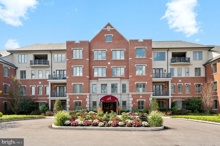 Welcome to Athertyn at Haverford Reserve by Pohlig builders.   This CORNER PENTHOUSE represents the absolute finest in maintenance free,  one-floor living.  Enjoy expansive wooded viewsheds from the treetops of Haverford Reserve.   This coveted Inverness floor plan includes two Bedrooms plus Study and Library spaces with two and a half Bathrooms.   The Gallery style entrance includes wainscot paneling details and arched cased openings leading to an open floor plan bathed in sunlight that only a Southwest exposure can provide!  Custom features and upgrades abound, including hardwood flooring throughout the entire home, custom built-in cabinetry, gas fireplace with custom mantle detail, pocket doors. plantations style shutters and more.  The Kitchen features Kountry Kraft cabinetry, Stainless Steel GE appliances and oversized Island complete with ceramic tile backsplash and quartz countertops.  Beyond the heart of the home, you will find a gracious Primary Suite with bay window, dressing room, two full walk in closets and luxurious Primary Bath.  Thoughtfully situated on the other side of the home, you will find an interior Library with rich cherry wood built-ins and a generous Guest Suite with Full Bath and two walk in closets.  Central Pantry Closet and full sized Laundry Room provide additional storage and functionality.  Underground parking (#12)  and storage (#2) are also included and transfer with the property.   Athertyn is the centerpiece of Haverford Reserve, a 209 acre residential & preservation development complete with nature & biking trails.   Homeowners enjoy use of clubhouse, pool & spa, tennis & pickleball court, putting green & gardens.  Your new lifestyle awaits!