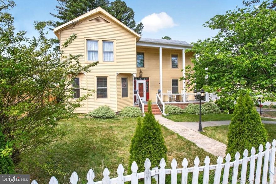Historic Charm. Exceptional Opportunity. Untapped Potential.

Welcome to a place where front porches invite conversation, neighbors know your name, and life moves at a more thoughtful pace. In the heart of Mineral, Virginia—at the gateway to Lake Anna—this 1899 Folk Victorian home offers a rare blend of historic character, small-town charm, and everyday livability.
From the moment you arrive, the home’s distinctive gable-front façade, decorative finials, and two-story front porch set a warm and welcoming tone. Bow bay windows fill the interiors with natural light, while original hardwood floors, crown moldings, chair rails, rosette-trimmed doorways, and a classic wood stair banister reflect the craftsmanship of another era.  

The layout is both comfortable and flexible, featuring three spacious bedrooms and inviting living areas ready to be enjoyed as-is or thoughtfully updated over time. The kitchen—anchored by a stainless-steel industrial sink—offers a functional starting point for creating a space that suits your lifestyle.
Out back, a covered porch overlooks a generous yard framed by mature trees—ideal for quiet mornings, weekend gatherings, gardening, or simply enjoying the seasons. With approximately 0.52 acres spanning three parcels—including two vacant lots with road frontage—the property offers room to grow, create, or invest at your own pace.  

Set along Mineral Avenue (Route 522) at the corner of W 5th Street, and zoned Light Commercial, the property presents subtle flexibility for those who may envision a live/work lifestyle, small business presence, or future expansion—while still feeling right at home within the town’s historic fabric.
Life here is refreshingly simple and connected. Stroll to local shops, dining, the farmers market, and Walton Park. Spend weekends on the water at nearby Lake Anna. Enjoy community events, friendly neighbors, and the charm of a town rooted in history and shaped by its mining heritage.  

Whether you’re seeking a full-time residence, a weekend retreat, or a property with long-term potential, this is a place where you can slow down, put down roots, and make it truly your own.

A rare opportunity to own a piece of Mineral’s history—schedule your private tour and experience it for yourself.