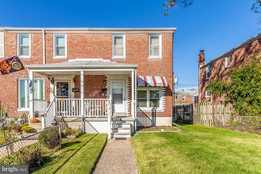 Meticulously maintained End-of-Group in North Point Village. A porchfront, all brick, home with three bedrooms and one full bath on upper level.  Carpeting on main and upper level covering solid hardwoods. Fully fenced level yard with gates and off street parking in the rear. Longtime owners took extraordinary care of this home and it shows.