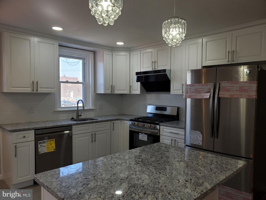 Welcome to this beautifully rehabbed property located in the heart of Castor Gardens.  It is tucked away on a quiet neighborhood street.  This home offers abundant natural light.  Beautiful hardwood flooring and recessed lighting throughout.  A large rear deck provides entertaining and an additional rear yard perfect for gardening.  This gorgeous large twin has over 1584sq ft.  The main floor boasts a spacious living room filled with much natural light.  The casual dining room opens to the modern design kitchen featuring an all white cabinets and granite counter top. All top of the line stainless steel appliances.  An island in the middle and a breakfast nook with beautiful ceramic tile flooring.  The powder room is conveniently located on the main floor.  The second floor features three spacious bedrooms with ample closet space.  An updated beautiful tile bathroom.  Master bedroom with master bath and two large closets.  Finished basement has ceramic tile flooring, a large storage room, NEW windows, NEW water heater and NEW HVAC system.  Don't wait and schedule your showing today!!!