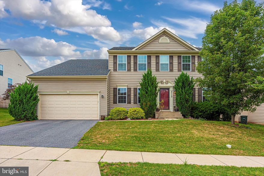 Beautiful large colonial in sought-after Cannon Bluff!  Over 3,600 sf of finished living space!  Classic yet modern colonial with lots of hardwood flooring on main level leading from spacious entry, down the hall and flowing into the large family room with gorgeous stone (gas) fireplace.  Upscale kitchen with large island (with seating) adjoins a light-filled breakfast room (with door to the level, fenced back yard.  Access to the two-car garage is just off the kitchen. The formal living room, formal dining room,  and den complete the main living level.  Upstairs is home to  a gracious primary suite, including walk-in closet and private bath with two sinks, ceramic floor and ceramic wall areas around soaking tub and shower.  Three additional bedrooms, a hall bath, and a laundry room are also on the upper level.  On the lower level you will find a  giant family room and lots of storage.