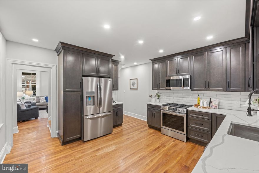 Welcome to 222 W Barnard St. This timeless twin home has been fully remodeled and is ready for a new owner. Everything is NEW (roof, windows, electric, plumbing,hvac, kitchen, baths and much more).  On a quant tree lined and desirable street you are just a short walk to the downtown and just far enough from the hustle and bustle of the school. Welcomed by a large covered front porch, you can enjoy a morning coffee or evening drink chatting with neighbors. Inside, white oak floors will lead you throughout the entire home. The first floor offers a large living room, gorgeous kitchen  open to the dining room with pantry as well has the rear mud room, half bath and laundry! All rooms have  tall ceilings, large victorian windows, recessed lighting and ceiling fans. On the second floor you will find a large primary suite with timeless tiled floors, double vanity, walk in shower and walk-in closet.  Other features include a  hall bathroom and second bedroom, which offers plenty of space and light through the attached sunroom. On the third floor you will find two more bedrooms which could also be used as office space if needed. Finally, the basement is partially finished with tall ceilings, recessed lighting and painted walls. This space is ideal for an additional family room, play room or storage. 

Additional features on the outside include a fenced rear yard,  brick patio and 2 car parking.