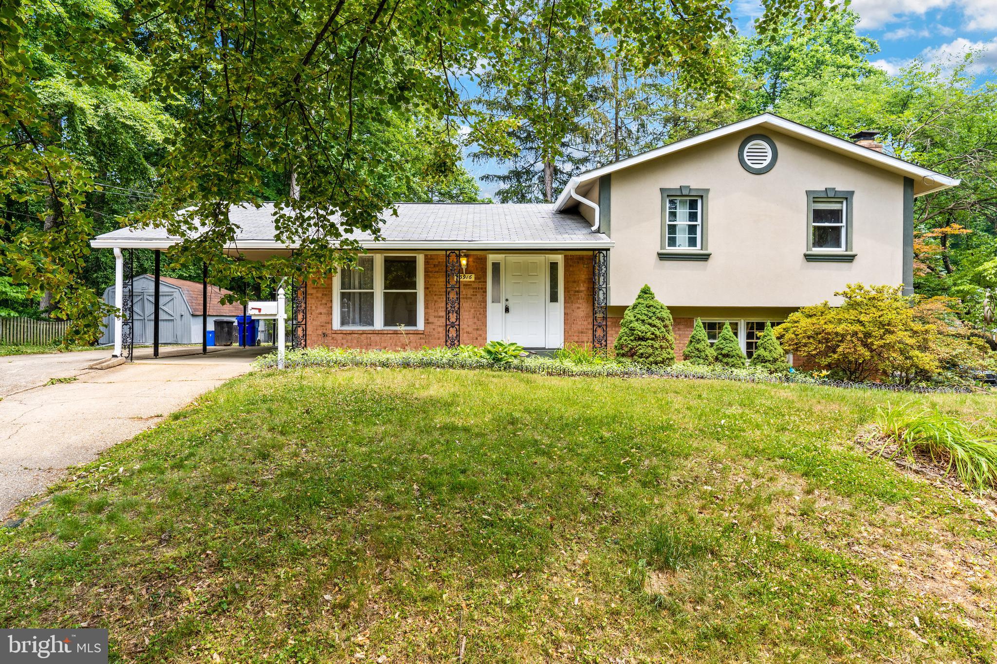 Spacious four-level split level home with lots of light, 4 bedrooms, 3 full baths, Updated kitchen with stainless steel appliances, new kitchen cabinets, granite counters and a center island, Living room with sliding glass doors to oversized deck, Separate dining room with sliding glass doors to carport, , Gas fireplace in family room, 3 large bedrooms on the upper level with plenty of closet space, One additional bedroom on the lower level, The lower level with walk out to patio and side yard, Large walk in closet in basement great for storage, Hardwood floors on main and upper levels, Laminate floors in family room, Carport with extra parking pad, Close to Rock Creek Park and shopping, All applicants must have a minimum credit score of 680 and a combined gross income of $148,000, Housing Vouchers Accepted.