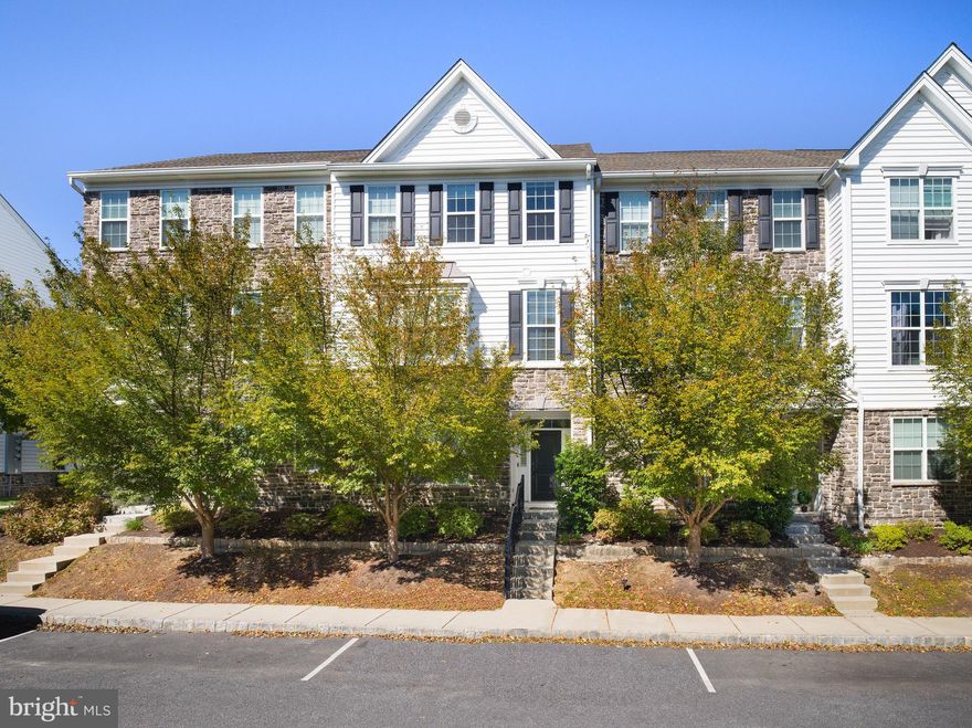 Beautifully upgraded townhome in the sought-after Ravenscliff at Media community. The first level features a welcoming foyer, bright finished room with double windows, and an oversized two-car garage. The main level offers an open floor plan with 9’ ceilings, upgraded hardwood floors, recessed lighting, and triple front windows for abundant natural light. The gourmet kitchen includes an oversized island with seating for six, upgraded white cabinets, top-of-the-line granite countertops, subway tile backsplash, oversized sink, stainless steel appliances, 5-burner gas stove, built-in microwave, and refrigerator. Sliding doors lead to a maintenance-free deck.The upper level features a spacious primary suite with tray ceiling, large walk-in closet plus additional closet, and a luxurious primary bath with dual vanities, walk-in shower with bench, dual shower heads, glass doors, linen closet, and private water closet. Two additional bedrooms with vaulted ceilings, a full hall bath, and a convenient laundry area complete this level. Enjoy low-maintenance living in a premier community close to downtown Media’s restaurants, boutiques, and theatre. Convenient to train, trolley, and major highways.