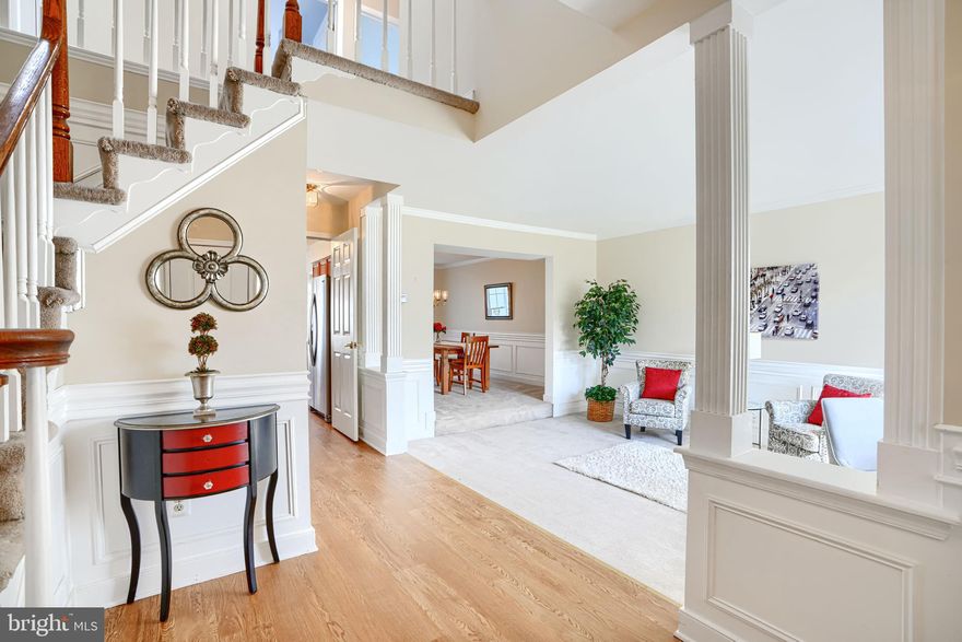 Lovely brick-front colonial with 2-car garage tucked away on a quiet cul-de-sac in the highly desirable Ramblebrook community of Perry Hall! This spacious home offers incredible versatility, including a potential in-law suite in the lower level with a separate side entrance. A welcoming 2-story foyer with NEW LVP leads to a sunken living room and a spacious formal dining room, perfect for entertaining. The well-appointed kitchen boasts a brand NEW refrigerator and NEW LVP flooring.  Breakfast table space opens to a freshly painted,  bright family room featuring brand NEW carpet,  wood-burning fireplace, vaulted ceiling and  NEW skylights. Large sliders lead to a freshly updated deck with all NEW boards and railings, ideal for outdoor gatherings. The main level also offers a convenient laundry room and half bath. Retreat to the expansive primary suite with cathedral ceilings, a bonus room (could be office , dressing room or sitting area) walk-in closets, private bath with soaking tub, separate shower, and double vanity. Three additional generously sized bedrooms and an updated hall bathroom complete the upper level. The finished lower level includes an improved club room with all brand NEW carpet,  wet bar, a potential 5th bedroom, a 3rd full bathroom, and a workshop with workbench. Additional highlights include a NEWLY waterproofed basement with sump pump and transferable warranty PLUS a brand NEW architectural shingle roof. Don’t miss this exceptional home in a sought-after location!