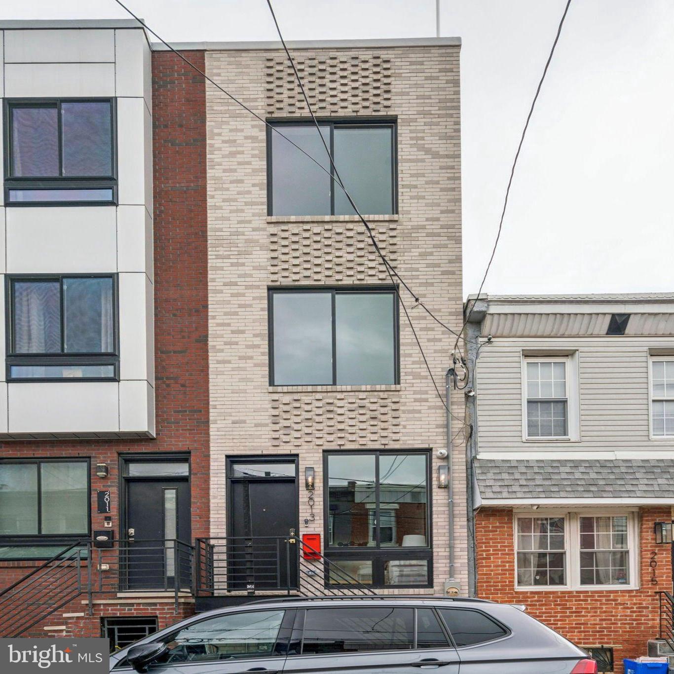 Welcome to 2013 E Firth Street, a beautiful brand new construction 4 bedroom, 3 bathroom home in the heart of Fishtown! Talk about luxury and attention to detail! This home boasts about 2,200 square feet of designer living space, carefully curated with custom accents in every room. Step inside and be greeted by white oak hardwood floors, stunning accent walls, and large windows allowing tons of natural light! The kitchen features stainless steel appliances, quartz waterfall countertop, tile backsplash, and dual toned cabinetry with brass fixtures. Upstairs, on the second floor you will find 2 spacious bedrooms with ample closet space a full bathroom, washer and dryer, and a large dog shower! The primary bedroom has a large walk-in closet and has an en-suite bathroom that features double vanity sinks, a soaking tub, and a sliding glass door shower. Don't forget about your private bar! The highlight of this home is your very own rooftop deck with skyline views! The finished basement offers an in-law suite with private bedroom and full bathroom, extra storage space and room for a home gym, home office, or secondary living space. In close proximity to all of the restaurants, bars, grocery stores, parks, and coffee shops that Fishtown has to offer, this home is in a perfect location. Schedule your showing today!