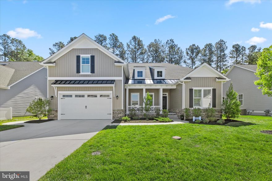 Welcome to refined coastal living in the highly sought-after Hawthorne community—where thoughtful design, exceptional craftsmanship, and a true sense of neighborhood come together.
This exquisite 5-bedroom, 3-bath residence, built in 2021 by Insight Homes, showcases the coveted Nelson model and offers approximately 3,674  square feet of beautifully curated living space. Every detail has been carefully considered to deliver both elegance and everyday comfort.
From the moment you enter, you are greeted by an inviting, light-filled interior enhanced by custom wainscoting, soaring vaulted ceilings, and an expanded living and breakfast area designed for effortless entertaining. The heart of the home is the elite gourmet kitchen—featuring striking quartz countertops, a butler’s pantry, premium finishes, and a newly installed Thermador dishwasher—perfectly blending form and function for the most discerning chef.
The first-floor primary suite is a true retreat, highlighted by tray ceilings and a spa-inspired en suite bath that offers both privacy and sophistication. Additional bedrooms provide flexibility for guests, home office space, or multigenerational living.
This home is further distinguished by an impressive array of upgrades, including a two-foot garage extension, enhanced recessed lighting throughout, a cozy fireplace, whole-house generator, dual-energy hybrid system, and a comprehensive water treatment system—delivering peace of mind and efficiency year-round.   An extra beverage refrigerator—whether it’s a dedicated wine chiller or a drawer for the kids' sodas—is a massive lifestyle upgrade. It frees up precious room in your main fridge for groceries and keeps guest foot traffic away from the "cooking zone."  A butler's pantry acts as a transition zone between your kitchen and dining room, keeping the main kitchen counters pristine while guests are over
Outdoors, the lifestyle continues. Backing to serene, wooded views, the property offers exceptional privacy and a beautifully designed outdoor living space complete with a screened-in porch and integrated sound system—ideal for quiet mornings or evening gatherings.
Located within Hawthorne—known for its tree-lined streets, vibrant community atmosphere, and resort-style amenities—this home offers the perfect balance of tranquility and connection, just minutes from Milton, Lewes, and the Delaware beaches.
This is more than a home—it is a statement of coastal luxury living at its finest.  See the video!