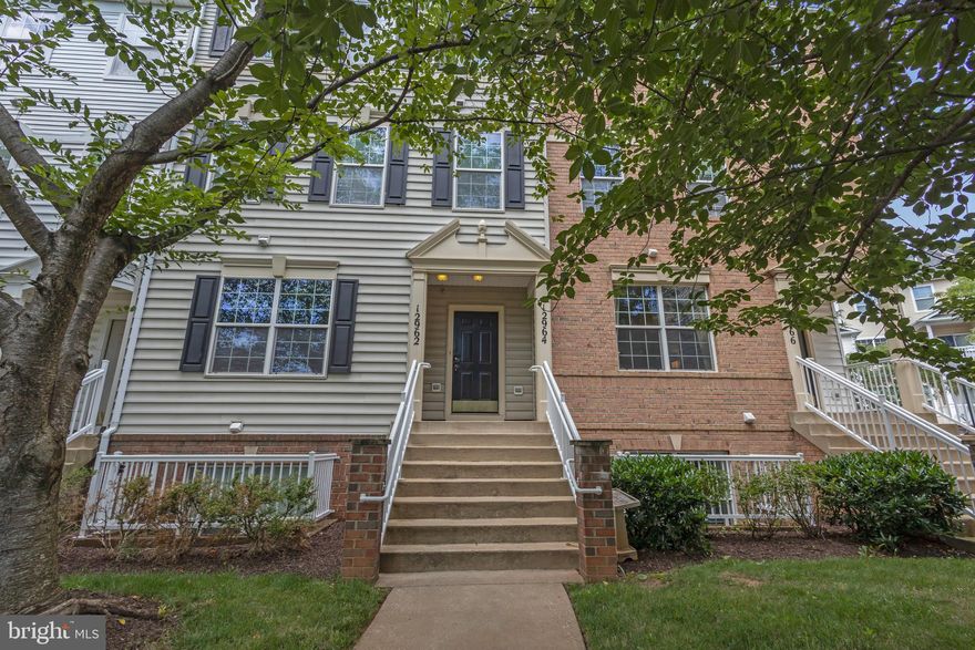 In demand; convenient Town Center location just off of I-270. Welcome home to this beautiful 3 bedroom, 2.5 bathroom townhome! Upon entering the home your eye is drawn to the gleaming hardwood floors all throughout the main living level. Abundant natural light pours through the windows and illuminates the front sitting room and living/dining areas. Enjoy the cozy fireplace in the living room! Adjacent to the living room is the fully-equipped kitchen with pantry for storage - large glass sliding doors fill the space with light and give you access to the balcony. Upstairs you will love to retreat into the primary bedroom which features its own private en-suite including a soaking tub and glass shower. Two more bedrooms with their own closet space, a full hall bathroom, and a conveniently-located laundry room completes this level. Enjoy the convenience of a 1 car basement garage with driveway in addition to one assigned parking spot and ample street parking for when you have guests. Recent updates include the furnace and air conditioner (2021) and hot water heater (2020). This home is in easy walking distance to the Germantown Public Library, children's playground, Black Rock Arts Theatre, many restaurants, shops, movie theatre, and other Town Center conveniences. Close proximity to medical centers, Montgomery County Police and Volunteer Fire Department, Marc Train; and only 100 yards to the Germantown Transit Station! Make this your dream home, today!