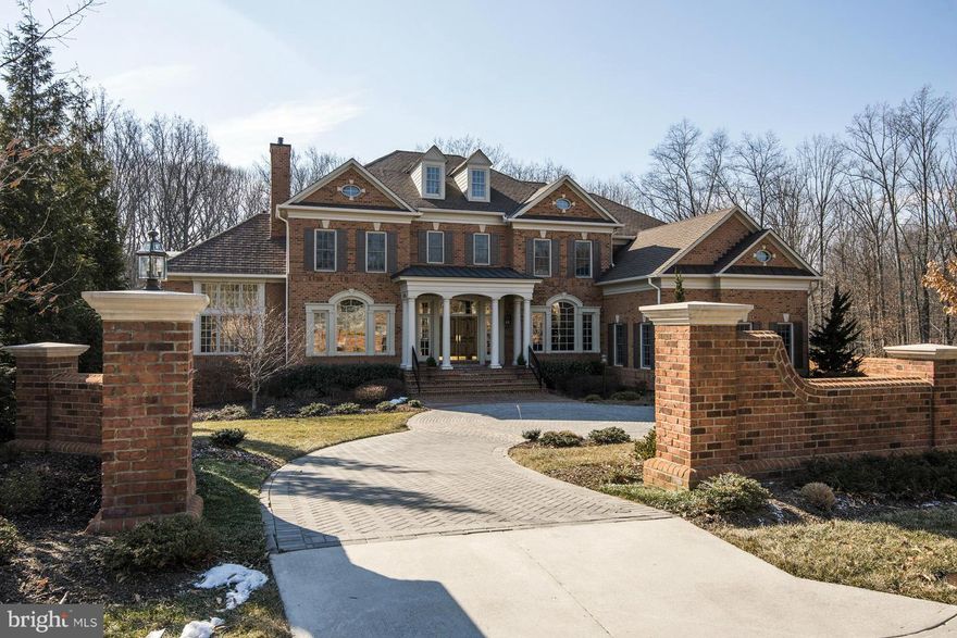 Stunning brick residence on quiet cul-de-sac backing to woodlands in highly desirable RESERVE.   Perfect for family living or grand entertaining. Highest finishes are found throughout! Offering sun filled public rooms, wonderful family room, gourmet kitchen, handsome library, luxurious master suite, & much .  Lower Level offers theater, exercise, & rec Room. 6 BR, 6 FB, 2 HB.  3-Car Garage.