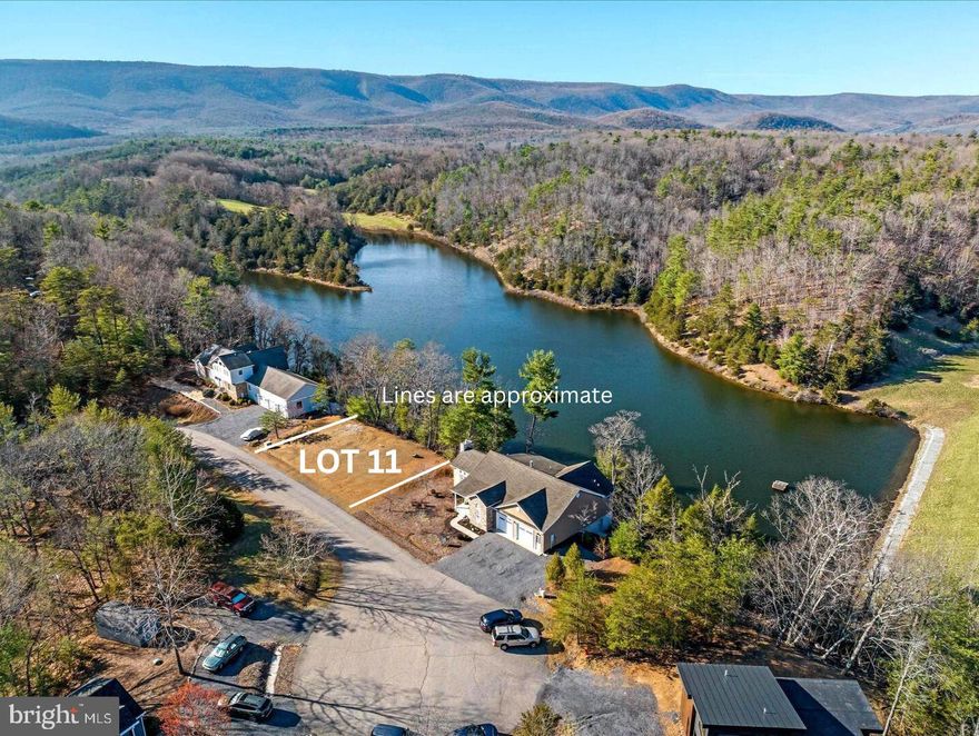 Discover the perfect canvas for your dream home at this exceptional Bryce Resort lakefront property! Cleared and ready for construction, this lot offers breathtaking views of both the mountains and serene Lake Carroll. Enjoy the freedom of a non-HOA property, combined with the convenience of public water and sewer services through Stoney Creek Water and Sewer—just a call and fee away to connect. With easy access off Resort Drive and a short walk to all the resort's amenities, this one-of-a-kind building lot promises unparalleled charm and convenience.
The resort area offers the following: small airport, library, dog park, indoor pool, outdoor pool, lazy river, pickleball, tennis, playground, 18 hole golf course, mini golf, lake, mountain biking, skiing, snowboarding, ice-skating rink, and restaurants, to name a few. 1.5 hours from NoVA. There is a farmers' market on Wednesdays during the summer. Call now for an appointment.