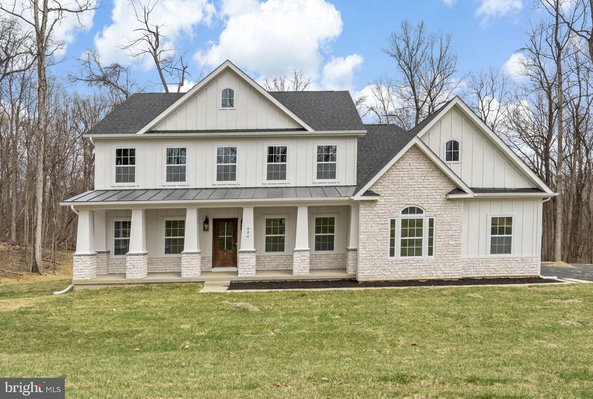 Timeless Colonial Charm Meets Modern Comfort—Move-In Ready!
Discover a perfect fusion of classic elegance and contemporary luxury in this newly constructed Colonial home, nestled on 3.94 acres of lush, wooded serenity. Offering unmatched privacy and peaceful surroundings, this refined retreat delivers the comfort of modern living without sacrificing timeless charm.
A beautifully paved driveway sets a sophisticated tone, leading to a striking Colonial façade enhanced by a full-width front porch with Craftsman-style columns—a perfect blend of traditional architecture and inviting curb appeal. Whether you're sipping morning coffee or unwinding in the evening, this charming porch offers a warm welcome and a peaceful place to relax.
Step inside to an open-concept floor plan bathed in natural light, where there are expansive windows that frame picturesque woodland views.
At the heart of the home lies a chef-inspired kitchen—complete with quartz countertops, custom cabinetry, stainless steel appliances, and a spacious center island perfect for casual dining or lively gatherings. The adjoining formal dining area and cozy family room with a fireplace create a warm and welcoming ambiance for both entertaining and everyday living.
The main-level primary suite is your personal sanctuary, featuring a spa-like en-suite bath with a soaking tub, walk-in shower, dual vanity, and generous walk-in closet. A versatile bonus room on this level is ideal for a home office, library, or playroom—tailored to your lifestyle needs.
Upstairs, three spacious bedrooms offer comfort and privacy, each with easy access to private or semi-private bathrooms—perfect for family members or guests.
Step outside onto the expansive composite deck to take in the beauty of your wooded oasis. Whether you’re hiking your private trails, hosting al fresco dinners, or simply enjoying the sounds of nature, this nearly 4-acre property invites endless outdoor enjoyment.
The fully finished garage is designed with convenience in mind, featuring two automatic openers, a pedestrian door, painted walls, finished flooring, and ample storage space.
In addition to its peaceful, secluded setting, this home is ideally located near a wealth of historical and recreational attractions. Explore nearby Civil War battlefields, hike or bike along scenic trails, or take a short drive to the vibrant towns of Harpers Ferry, Charles Town, Leesburg, and Winchester. Whether you're a history enthusiast, outdoor adventurer, or just looking to enjoy charming local destinations, you'll find something for everyone just minutes away.
Though tucked away in nature, you’re just a short drive from top-rated schools, shopping, and everyday amenities. Whether you're looking for your forever home or a luxurious weekend escape, this Colonial masterpiece offers the best of all worlds—timeless style, modern comfort, and natural beauty.
This exceptional home is ready for you—schedule your private tour today!