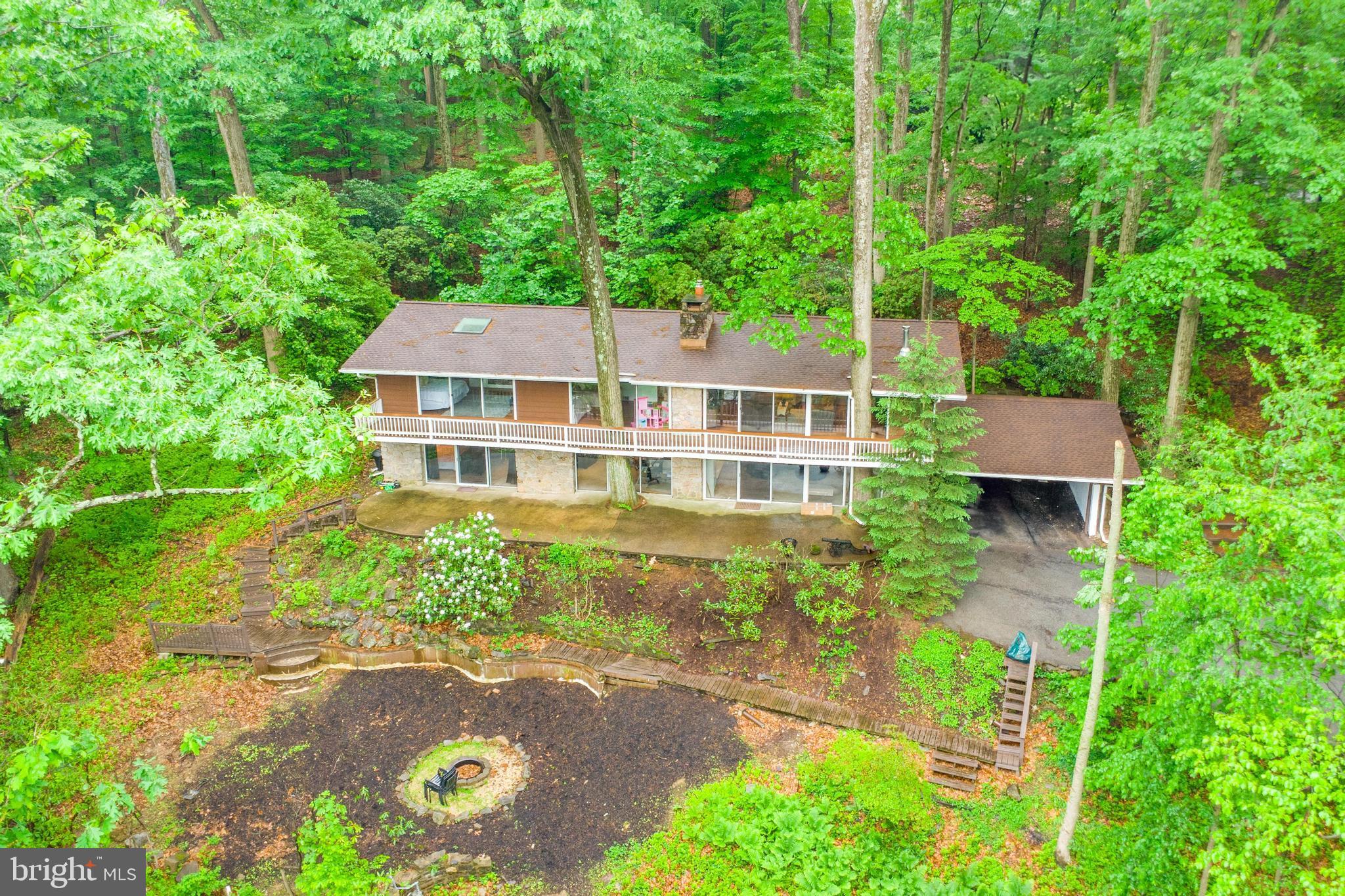Welcome to this beautiful 5 bedroom, 3 bath single-family home nestled in the sought-after Valley Forge Mountain neighborhood within the Phoenixville Area School District. This unique property offers a perfect blend of nature, comfort, and modern living.
Step inside to an open floor plan filled with natural light from an abundance of windows and skylights. The spacious living area features a full-wall stone wood-burning fireplace, ideal for cozy evenings. The kitchen is designed for functionality and features a sunny breakfast area beneath a skylight. A formal dining room opens via sliders to a serene natural stone patio—perfect for entertaining or enjoying a quiet meal surrounded by nature.
The master suite is a true retreat, boasting a spacious ensuite, skylights and sliding doors that lead directly to the expansive, house-length deck, where mature trees elegantly pass through the decking for a peaceful, treehouse-like feel. This level features two additional spacious bedrooms and a hall bath and tub/shower combo. The lower level provides endless opportunities, with a wood burning stone fireplace, bar, sliders to the expansive patio, two additional bedrooms and a full bath with double vanity.
Enjoy year-round comfort with natural gas heat, central air (new in 2024), and 200 amp electrical service. The roof was replaced in 2023, offering peace of mind for years to come.
Located just minutes from Valley Forge National Historical Park, King of Prussia Mall, and major commuter routes, this home offers peaceful, tranquil living and yet, is convenient and easily accessible to every imaginable amenity! Don’t miss the opportunity to make this one-of-a-kind home your own! Please note, the price corresponds with the property's current condition, needed repairs and endless potential.