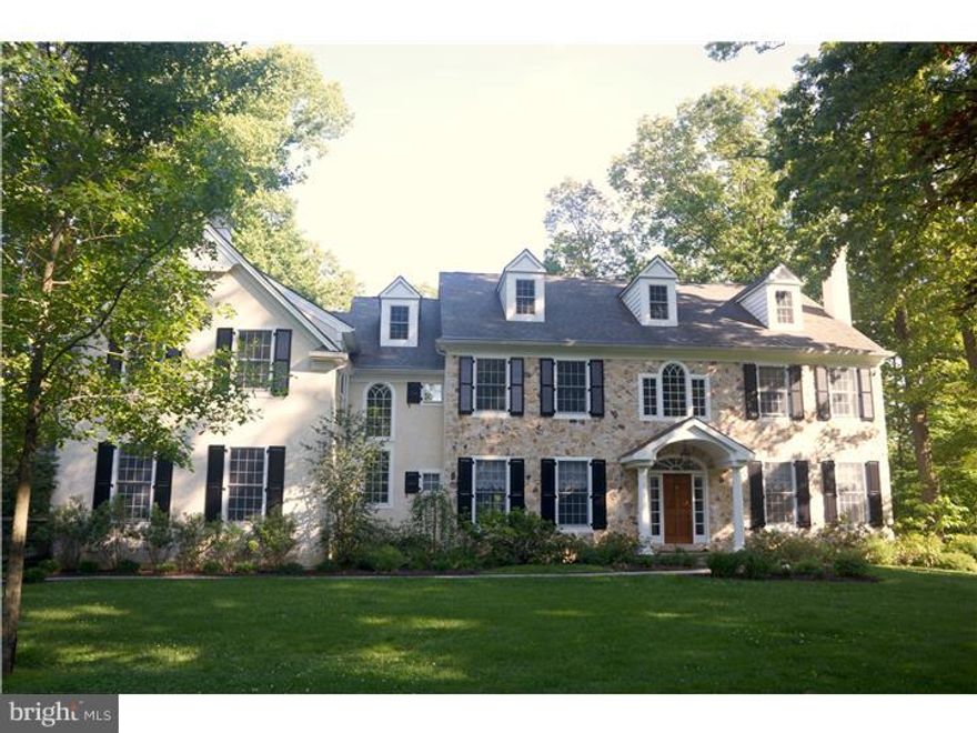 Spectacular Colonial Home!  Two story Entrance Hall with dramatic curved staircase. Living Room with fireplace and Dining Room with a fireplace.  5 Bedrooms, 5 full Baths and 2 Powder Rooms. Eat-in Kitchen plus a large Breakfast Room. The Kitchen has a large center island, granite counters and Viking appliances. Office and extended deck overlooking private lawn. 2nd floor Master Bedroom with sitting room, large walk-in closet and Master Bath; two Bedrooms each with its own Bath; two more bedrooms with a shared Bath. Finished Basement with bar, full Bath and French doors to flagstone terrace. Storage. Home on a Lovely lot near Upper Main Line Y and transportation. Award winning Schools! A must see!