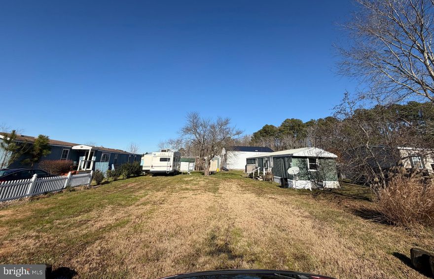 Location Location Location! THIS IS THE PERFECT INVESTOR PROPERTY. NO RESTRICTION ON SHORT TERM RENTAL AIRBNB. Build your own rancher or install a new modular home, this delightful manufactured home offers a perfect blend of comfort and functionality. Built in 1987, this well-maintained residence spans 896 square feet, providing a cozy retreat for those seeking a peaceful lifestyle. Step inside to discover a warm and inviting atmosphere, featuring two spacious bedrooms and two full bathrooms, ensuring ample space for relaxation and privacy. The open layout encourages seamless flow between living areas, making it ideal for both quiet evenings and entertaining friends. The exterior boasts durable aluminum siding, enhancing the home’s curb appeal while requiring minimal upkeep. Set on a generous 0.25-acre lot, the property offers plenty of outdoor space for gardening, play, or simply enjoying the fresh air. With a driveway that accommodates two vehicles, convenience is at your fingertips. While this home does not feature a pool, the surrounding community provides a serene environment perfect for leisurely strolls or enjoying nature. The absence of a fireplace allows for a clean slate, inviting you to personalize the space to your taste. This charming residence is not just a house; it’s a place to create lasting memories. Whether you’re looking to downsize or seeking a peaceful retreat, this home in El Rancho Roxana is ready to welcome you. Don’t miss the opportunity to make it your own!BRING ALL OFFERS