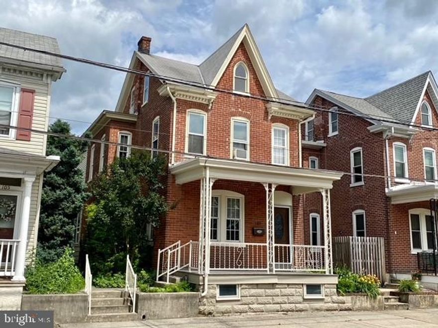 Attractive and spacious Colonial in the heart of Boyertown.  Located on a scenic side street, this beautiful and welcoming home is just a short walk from an array of unique eateries, coffee shops, the historic State Theater movie house, popular Colebrookdale Railroad tourist train line, public library, and parks in a charming downtown which hosts a collective of fun and entertaining activities throughout the seasons.  Greet guests on the deep inviting front porch with an ornate doorway that opens to the oversized great room with hardwood flooring, tall ceilings,  handsome brick fireplace, and open bannister staircase.  Double glass doors lead to the spacious country kitchen with tile flooring, double sink, counter peninsula, plenty of cabinet space and generous dining area.  A bright mudroom and convenient powder room are also located on the main level.  The second floor houses 3 bedrooms including a beautiful main bedroom suite with newer hardwood flooring, elegant sconces, crown molding and an adjoining dressing/sitting room.  The custom and stylish bathroom includes an oversized vanity, extensive tilework and an alcove with a 10-jet Jacuzzi whirlpool tub/shower.  There is also a storage room with a closet organizer unit on the second level.  The walk-up attic could easily be converted to additional living space.  Discover an array of interesting  vintage and architectural elements throughout the home.  Many replacement windows. Central vacuum system.  You will be all set for outdoor relaxation, entertaining and gatherings in the charming back yard with extensive hardscaping featuring a beautiful 22'x26' paver patio.  A  pergola archway covers the walkway entrance to the detached 2 car garage.  Be sure to check out all that this beautiful Boyertown residence has to offer.
