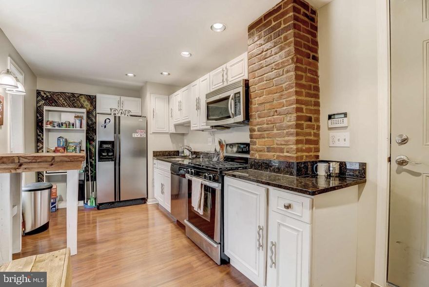 This two bedroom apartment has 2 full bathrooms, updated appliances and beautiful hard wood floors. The main level has a living room that looks out over Charles St. and opens up into an open concept kitchen with the first bedroom on the backside of the main level. Up the stairs you will find the second bedroom with a full bathroom and walk in closet. This apartment is located in the pinnacle of Federal Hill as it is right beside the highly sought after Cross St market.