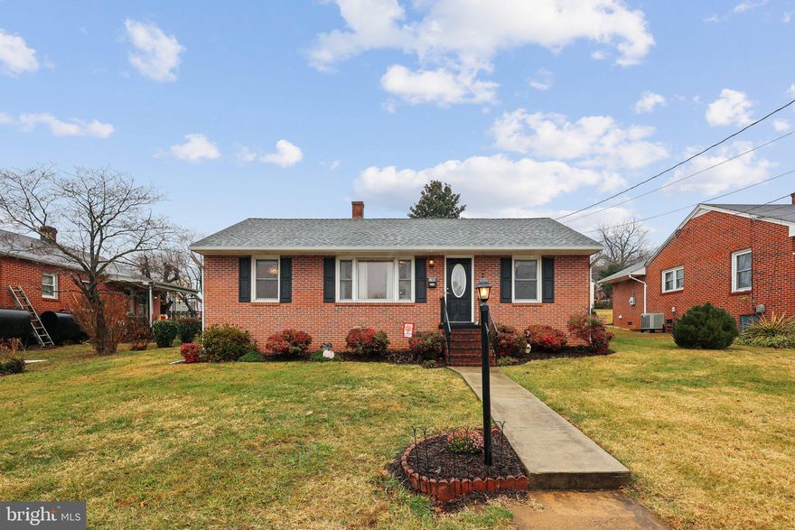 Charming all-brick rambler in a quiet Orange neighborhood, offering single-level living with multiple system updates. Home features 2 bedrooms, 1 full bath, hardwood floors, country kitchen, separate laundry room, and an enclosed back porch. Furnace replaced 12/30/2022 by Pierce Heating & AC. Heating fuel tank replaced 7/16/2019 by Southern States/Culpeper Petroleum. Hot water heater replaced May 2021.  *****   Kitchen updates: Cabinets refaced by Sears in January 2006; kitchen windows replaced July 2020 via Window World; refrigerator approx. 4 years old; dishwasher new November 2025.   **** Windows: replaced most windows with vinyl (bedrooms, living room side windows, dining room, laundry room). Picture window in living room remains original.  **** Front door: Oval leaded-glass door installed in 2007.  ****  Additional updates: New blinds (November 2025) in bedrooms & dining room.
Location: Quiet neighborhood with long-term neighbors. Walking distance to Orange High School and short drive to town amenities including shopping, banks, restaurants, and gas stations.