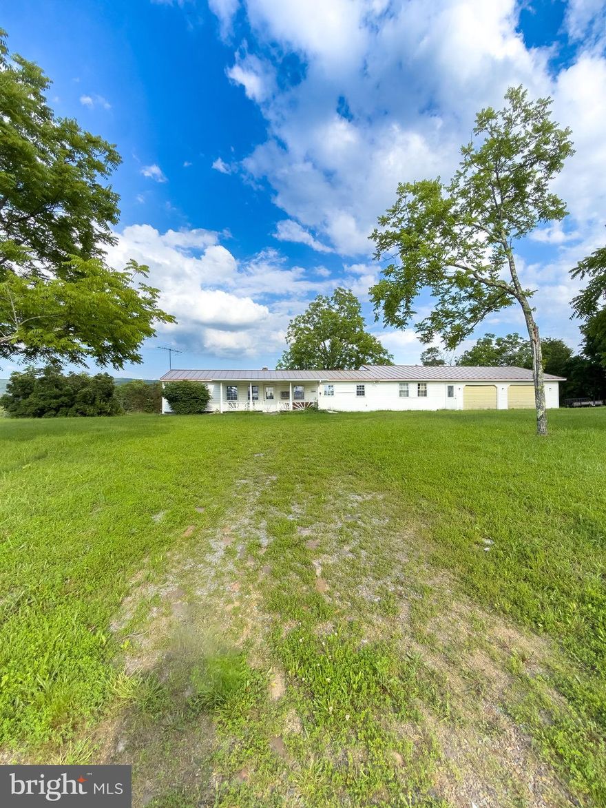 Welcome to 11101 Winchester Grade Rd, Berkeley Springs, WV—a spacious ranch-style home nestled on 2.25 unrestricted acres. Imagine the possibility of building on the lot behind the home, creating a private oasis. This home boasts an expansive floor plan, offering extra flexibility for your needs. Step outside to a rear deck overlooking a spacious backyard, perfect for relaxation or entertaining. The oversized 2-car garage includes a built-in workshop, ideal for hobbies or storage. Conveniently located just a short drive from charming downtown Berkeley Springs, you’ll enjoy nearby attractions like Berkeley Springs State Park and Cacapon State Park. Explore local shops and restaurants, making this property a great choice for those seeking comfort, stunning views, and ample space to grow. With no HOA or restrictions, you’ll have the freedom and space to create your own tranquil living environment.