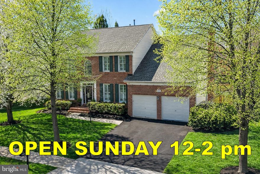 This beautifully maintained and extensively updated brick front Colonial in the heart of Brambleton offers generous living space across three finished levels, where custom design, quality finishes, and everyday comfort come together with ease.
<br><br>
From the moment you arrive, the home’s curb appeal stands out with its landscaped yard, two-car garage, classic architecture, and inviting front entry. Inside, a two-story foyer creates a striking first impression, opening to formal living and dining rooms with elegant moldings and natural light, creating spaces that feel refined and warm. A private home office is thoughtfully positioned on the opposite side of the foyer, offering both function and flexibility.
<br><br>
The main living spaces are anchored by a chef’s kitchen that is both refined and highly functional. It features granite countertops, abundant cabinetry, an oversized center island with seating, double wall ovens, and recessed lighting. An impressive custom walk-in pantry, featuring butcher block countertops and generous storage, adds convenience and organization. The kitchen flows seamlessly into the breakfast area and family room, where a wood-burning fireplace creates a welcoming atmosphere.
<br><br>
A well-designed mudroom with built-ins, hooks, shelving, and a utility sink adds everyday practicality, while plantation shutters throughout the home bring a layer of timeless sophistication.
<br><br>
Upstairs, the primary suite is an extraordinary retreat that rivals luxury residences. A cathedral ceiling, architectural columns, and a private sitting room create a sense of scale and serenity. A standout feature of the home is the exceptional custom dressing room, an expansive, boutique-style space measuring approximately 20x11, designed with tailored storage solutions and designer finishes. This is far more than a closet—it’s a true extension of the suite and an uncommon feature that sets this home apart. The renovated primary bath complements the suite with a large walk-in shower that includes a rainfall feature and two additional shower fixtures, delivering a truly indulgent experience.
<br><br>
Secondary bedrooms are equally well-appointed with plush carpeting, ceiling fans, generous closet space, and access to the hall bath. Bedroom-level laundry adds an extra layer of convenience.
<br><br>
The lower level continues the home’s elevated aesthetic, offering a beautifully finished walk-up basement designed for both entertaining and everyday enjoyment. A custom wet bar serves as the centerpiece, complemented by a spacious recreation room, private guest den, dedicated gym, and full bath.
<br><br>
Outdoor living is equally inviting, featuring a screened-in porch with two hard-wired electric heaters for year-round enjoyment. The landscaped backyard includes a newly replaced fence (2025), providing added privacy and a clean, finished look. Enhancing the modern appeal, integrated smart home technology allows for easy control of lighting, locks, garage doors, and security directly from your phone. The home has been well maintained, with recent updates including a newly repaved driveway (2025), replaced porch screens (2023), and new upstairs carpeting (2026).
<br><br>
Located in sought-after Brambleton, residents enjoy access to miles of scenic trails, multiple pools, parks, and easy access to Brambleton Town Center, dining, shopping, and major commuter routes. This is a rare and distinctive home, offering space, quality, and standout features in one of the area’s most desirable communities.