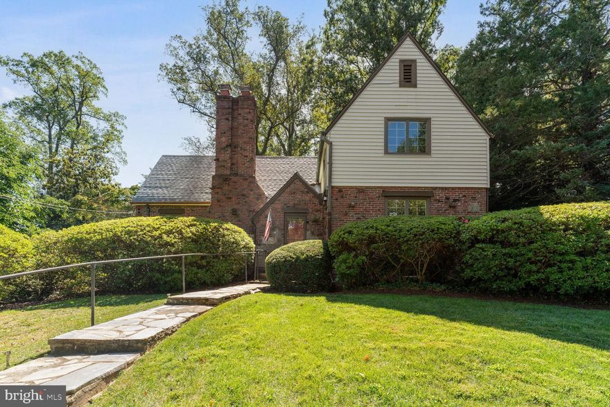 Conveniently located close to schools, shopping, National Airport, routes 29, 66 in the sought after Country Club Hills neighborhood. This gorgeous 3 level Tudor boasts of beautiful architectural details along with many recent updates. With approximately 3500 square feet of finished space, the house is comprised of 4 bedrooms, 3full baths and 1 half bath. The main level features a 2 story gracious living room with cathedral ceilings (the wood beams were salvaged from the Chain Bridge dating back to 1874) ,
oversized wood-burning fireplace,  leading to a family room addition with cathedral ceiling, large kitchen with updated stainless steel appliances, granite countertops, kitchen island with plenty of storage. Also on the main level are the formal dining room, 1st floor bedroom with private full bath, separate powder roomand laundry closet. The incredible upper level features 2 large bedrooms with an oversized jack-n-jill full bathroom and a sitting area overlooking the 2 story living room. The lower level features 2 large recreation rooms, the 4th bedroom with connecting full bathroom, utility room leading to a 2 car attached garage.  The property consists of 3 separate lots totaling 16,047 square feet and beautifully landscaped with mature trees, shrubbery,  2 separate outdoor patios and a garden shed.