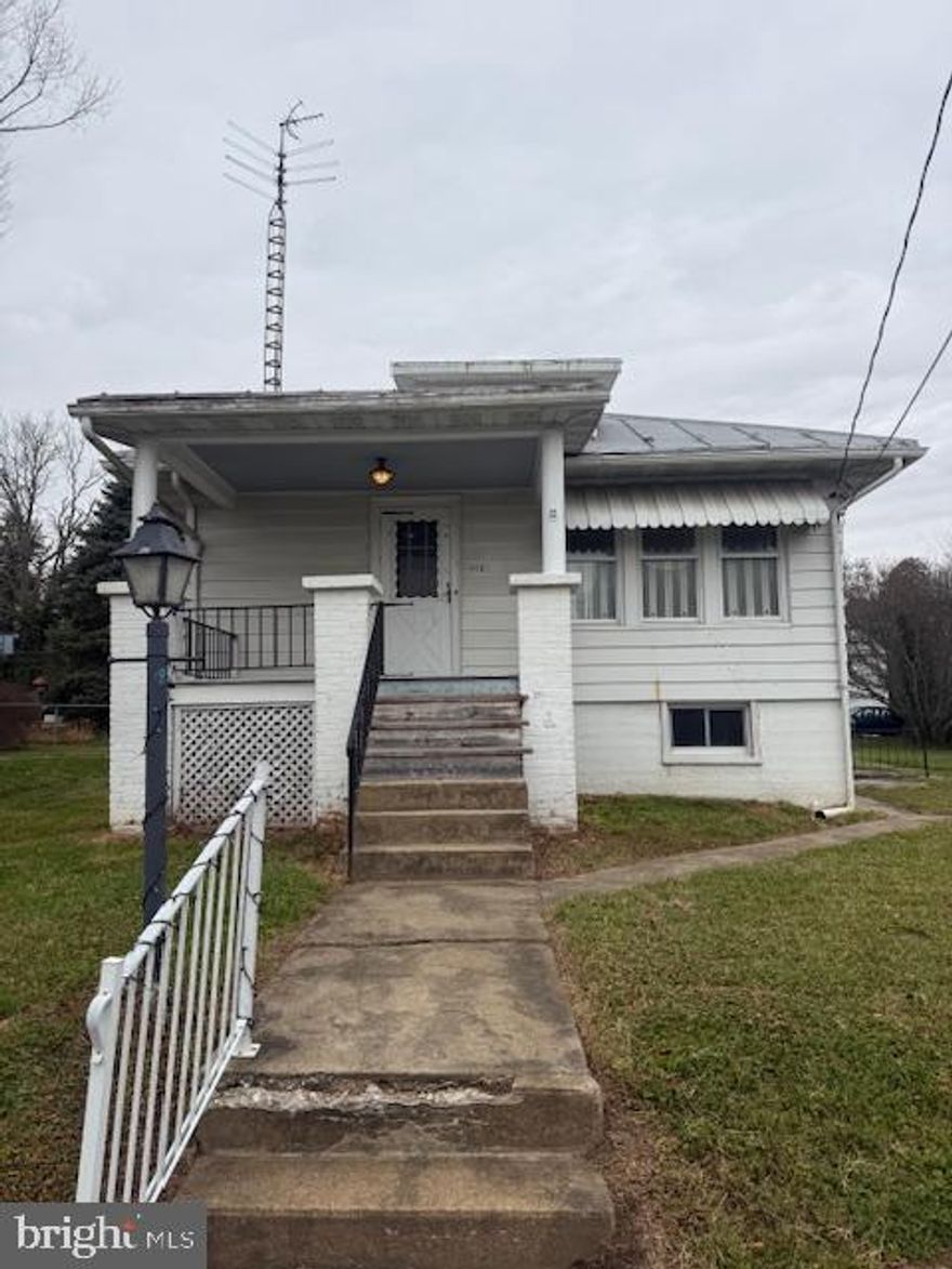 Charming little rancher located within the city limits of New Windsor, a quaint and peaceful small town. This 2-bedroom, 1-bath home offers great potential for a buyer with a vision. Features include public water and sewer, plus a detached garage for extra storage or workspace. Bring your ideas and creativity to update this home and make it your own cozy retreat. This cute little home will not last long!