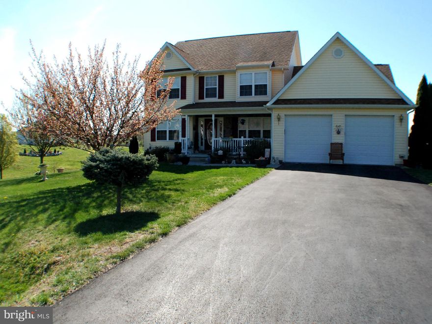 "Pride Of Ownership shows"4 BR 2.5 BA Colonial with owners suite on the main floor with double vanities, Sep.Jetted tub,shower ,walk in closet.Family room w/ vaulted ceiling & Gas Fp.Formal dining and living rooms have HW floors. Kitchen w/Breakfast bar & Sun room .Very Private location ,enjoy your rear deck with spectacular private views. Unfinished basement has workshop area,LG.Storage Building.