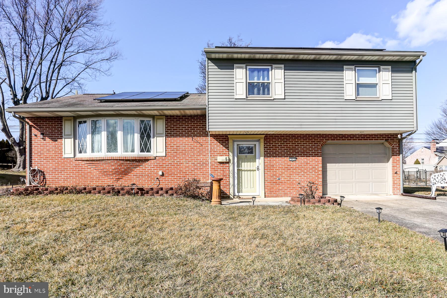 Welcome home to this move-in-ready split-level in the heart of Shiremanstown, within the sought-after Mechanicsburg School District! This spacious home features a traditional first-floor layout with a bright living room, formal dining room, and a beautifully renovated kitchen. Upstairs, you'll find three bedrooms, including a full guest bath with a tiled shower and a primary suite complete with dual closets and an ensuite full bath. The lower levels provide even more versatile living space, starting with a spacious family room featuring a cozy fireplace and a convenient powder room. The lowest level offers additional finished space, perfect for a home office, gym, or playroom, along with laundry and ample storage. Enjoy outdoor living on the covered rear patio overlooking the large backyard. This home is also equipped with solar panels, offering energy efficiency.