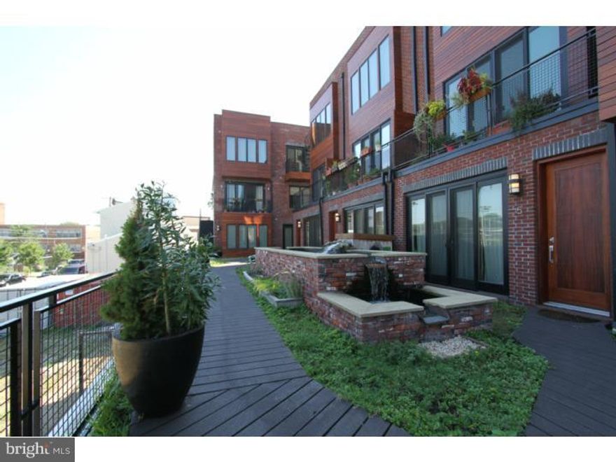 The Icehouse is a "Green" New-Construction Development comprised of 35 Condominiums and one corner commercial space located in the heart of Fishtown, just a few blocks from the Delaware River Waterfront. The property is directly adjacent to Hetzell's Ball Field, a recreational City Park encompassing an entire square block. This Icehouse Unit #3 is a Phase 1 construction. Features include: 1 bedroom, 1 bath, an open modern floor plan, solid hardwood throughout, Caear Stone counter tops, built in pantry, a 4  person island with under mount sink and goose neck faucet, Energy Star appliances and HVAC, ample storage, energy efficient windows, stack washer and dryer laundry nook, glass tile bath with vessel sink, vanity storage, and a private balcony off of the bedroom. There is 1 car deeded garage parking included with electric garage door and secure pedestrian entrances. This condo is nestled amongst landscaped green spaces, walking paths, outdoor open shared grill and a panoramic roof deck and dog park. This development has LEED Certification. Many of the units include private rooftop decks / green roofs with amazing views of the City Skyline and The Ben Franklin Bridge. There is also a large common rooftop deck / green roof as well as a rooftop dog park. Located just a few blocks outside of Northern Liberties, The Icehouse is only minutes from Center City. Approximately 5 years left on the 10 year tax abatement.