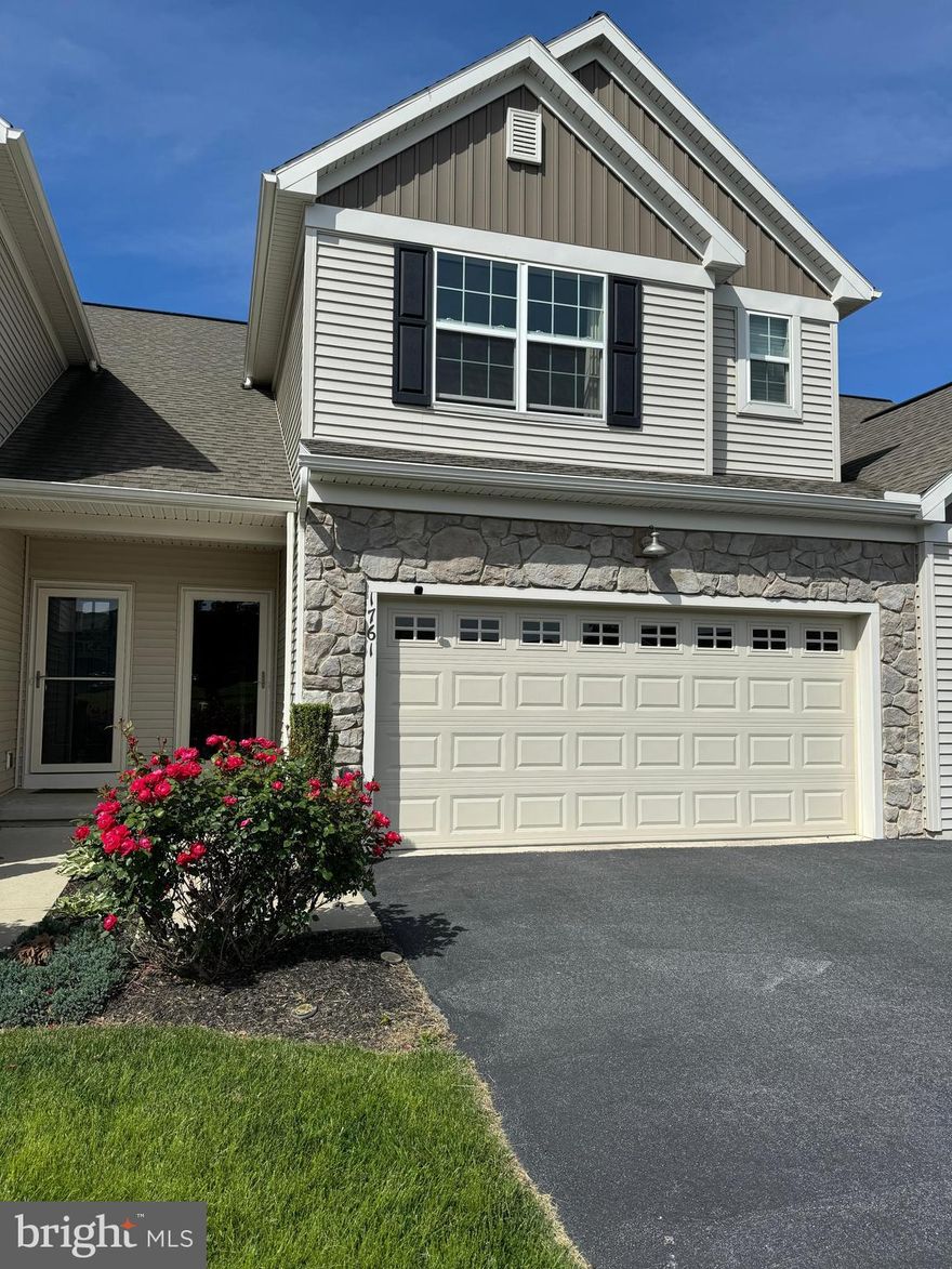 Welcome Home to North East facing 1761 Shady Lane, set within the highly-desirable neighborhood of Hanbury Court in the prestigious Winding Hills community.   The Ellsworth Model was built by Landmark Homes and is a spacious two-story townhome featuring an open concept floor plan with 9' ceilings throughout the first floor.   The Gourmet Kitchen with expansive center island, accent lighting, seating for 3, stunning quartz counters and Wellborn Cabinetry is elegant, as well as functional.   You will notice an abundance of light and airy cabinetry, quartz-lined backsplash, stainless steel appliances, luxury vinyl plank flooring, recessed lighting, as well as a corner walk-in Pantry for added storage.  The Kitchen opens to the generously-sized Family Room with LVP flooring, recessed lighting and an abundance of sunlight.   The functional Dining Room also features LVP flooring with glass sliding doors, leading to your quaint deck with privacy fencing.   The second level consists of a luxurious Owner's Retreat with plush carpeting, lots of light and a stylish tray ceiling.   Also included is a roomy walk-in closet, as well as an ensuite Bathroom with a 5' shower with glass doors, double bowl vanity, as well as a linen closet.  The 2nd Floor Laundry Room includes a washer and dryer, as well as built-in upper and lower cabinetry for added storage.    The second and third spacious Bedrooms have lush carpeting and substantial closet space.  A shared full hallway bathroom with tub/shower combo completes the second floor.   If you need extra space, you're in luck!  The Lower Level is finished with soft carpeting, recessed lighting, as well as a walk-out to the rear and spacious yard.   A Half Bathroom completes the lower level.   The rear patio leads to the yard is thriving with green grass, mature trees and is teeming with nature, from the chirping birds to the daily visits from the deer.    Outside your door is an expansive green space with a center set of swings.  This home features a two-car Garage, driveway parking for 2 cars, as well as 5 community parking spaces right across the street!  You'll never have to worry about visitor parking.   Your monthly fees include lawn maintenance, snow removal and community amenities.   There is everything to love about living in Winding Hills, from the heated, in-ground salt water pool, to the community clubhouse with fitness center, miles of walking and jogging trails, walkability to local playground and park, plus all of the convenience the location has to offer to shopping, dining, cultural events, as well as proximity to churches, schools, hospitals and highways!   Call your Realtor today to schedule a tour!