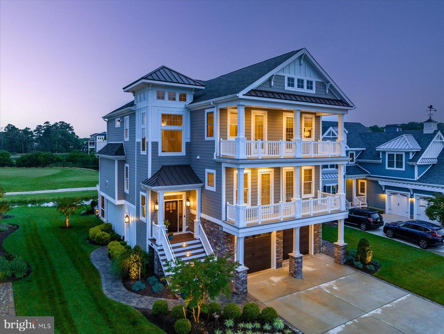 Welcome to this exquisitely detailed Antigua model built by Echelon Custom Homes in the prestigious Bayside Resort Golf Club and Community.

This luxurious home has extensive upgrades throughout including expanded dining room, primary bedroom, and first floor family room. You will find custom built-in cabinetry, custom woodwork, and custom closets through out the home. Gourmet appliances, upgraded flooring and moldings, a coffered ceiling with grass cloth in the kitchen/dining room, elevator, upgraded lighting fixtures. There are 2 Rinnai Tankless hot water heaters, whole house central vacuum with internal hoses, 2 zone A/C, and 2 split units on the first level. The list goes on and on. 

This professionally decorated 5 bedroom, 4 ½ bath home is being sold fully furnished (with some exclusions) to allow for turnkey immediate occupancy. The custom high quality window treatments convey.

The gourmet chef’s kitchen with Ella Quartz countertops and beautiful custom maple cabinets offers a stainless steel Wolf 48” range with 2 ovens, a separate wall mounted Wolf Oven, a wall Microwave, Sub Zero 48” refrigerator, Bosch Dishwasher, Wine Fridge, Ice maker, a farmhouse sink and a walk-in pantry with loads of storage.  
There are Wi-Fi extenders on the first and third floors. There is a mini theater on the first floor with an 80" Sony Bravia TV, sound bar, rear speakers in the ceiling and external subwoofer.

The rear of the house enjoys stunning sunrise to sunset vistas of the 10th hole of the Jack Nicklaus Signature Golf Course.  There are screened porches on the first and second levels.
Enjoy the serenity of the natural marsh teaming with abundant wildlife on the Assawoman Bay. Evening views are equally stunning of the shimmering Ocean City Skyline. The views from this home are spectacular. 

 The custom-built patio is an entertainer’s dream with generous seating and a built-in waterfall,  a hot tub,  and surrounded by professional landscaping and lighting.

Bayside residents enjoy many exciting amenities including 4 outdoor pools, a children’s splash zone, tennis courts, brand new pickle ball courts, and basketball courts. The Health & Aquatic Center has a large heated indoor pool, hot tub, saunas, a state-of-the-art fitness center and a fresh juice and sandwich bar. There is a Beach Shuttle that will take you to the Fenwick State Park beach, just 5 miles away. Enjoy kayaking, stand up paddle boarding on the Assawoman Bay There is also a dock, pier and beach on the bay. Or enjoy a show at the Freeman Arts Pavilion. There are plenty of places to eat in Bayside including Signatures Restaurant, 38 Degrees-a waterfront bar & grille, and snack bars at most of the pools.
Now is the time to live your best life in Bayside!