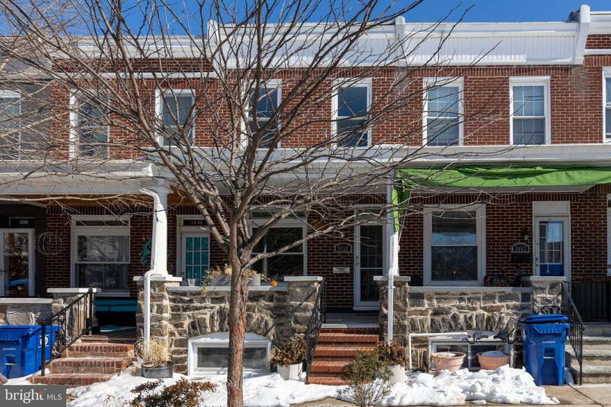 Welcome to this Hampden gem! From the large covered front porch, step inside to the living room with hardwood floors and tons of natural light. The updated kitchen shines with stainless steel appliances, beautiful tile flooring, and a huge floating island that's perfect for extra storage and hosting friends. Just off the kitchen, a rear porch leads down to a fully fenced patio area- great for entertaining. Upstairs you'll find the primary bedroom with en-suite bath, plus a second bedroom and hall bath. The finished lower level offers even more space with a recreation area, third bedroom, full bath, and laundry. Updates include windows, kitchen appliances and flooring (2025), HVAC, water heater and basement carpet (2022), and roof (2019). All of this just a few short blocks from the shops, dining, and energy along The Avenue, with easy access to everyday conveniences that make Hampden such a great place to call home.