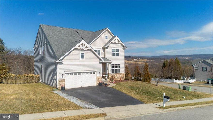 Perched in the sought-after Saber Ridge community, this exceptional 4,700+ sq ft home offers sweeping mountain views, rare privacy, and a lot that backs to trees and open space. Located within the highly desirable Middletown school district, this home is set on nearly three quarters of an acre where you can start and end your day with peaceful scenery in a quiet setting that still remains conveniently located. Inside, the home is designed for both everyday living and entertaining, featuring 4 spacious bedrooms, 4.5 bathrooms, and a dedicated home office ideal for remote work or study. The main level offers an open and inviting layout with abundant natural light and a seamless flow between living spaces. The well-appointed kitchen connects effortlessly to the main living areas, creating a central gathering space for hosting or relaxing at home. Downstairs, the fully finished lower level expands your living space even further and is perfect for a media room, home gym, guest suite, or a combination of all three, offering the flexibility today’s lifestyle demands. Step outside to enjoy the expansive yard and surrounding views, with ample space to create your ideal outdoor retreat. Whether it’s morning coffee overlooking the mountains or unwinding in the evening, this home delivers a rare combination of space, comfort, and tranquility. This is a unique opportunity to own a beautifully sized home with scenic views, added privacy, and a peaceful setting in one of Myersville’s most desirable communities.