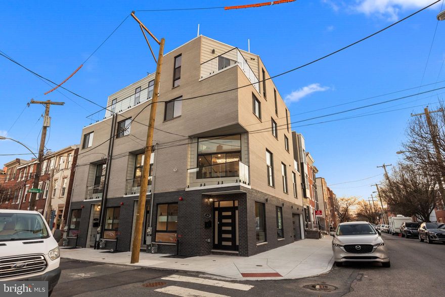 SELLER IS EXTREMELY MOTIVATED!    LET'S MAKE A DEAL, BRING US AN OFFER!     FUN OPEN HOUSE SUNDAY MAY 18TH, 12:00-5:00PM, FUN FOR THE FAMILY WHILE TOURING 4 AMAZING PROPERTIES. to 246 Montrose Street—an extraordinary residence in The Estates at Queen Village, an exclusive enclave of newly constructed luxury townhomes in one of Philadelphia’s most desirable neighborhoods. Enjoy a *FULL 10-YEAR TAX ABATEMENT* and *BUILDER MORTGAGE RATE INCENTIVES* while living in a home built with the highest quality materials and superior craftsmanship from the ground up.

This stunning 4-bedroom, 4.5-bath residence pairs timeless design with modern sophistication. The elegant white brick façade nods to classic Philadelphia architecture, while inside, every detail is elevated by refined finishes and thoughtful upgrades. Sunlight pours through oversized windows, filling each space with warmth and style. The one-car garage features epoxy floors and an EV charger, setting the tone for a home built with purpose and precision.

Step through the custom foyer into a sleek mudroom with built-in storage and direct garage access. The lower level provides a flexible retreat—perfect for guests, a home office, or gym—complete with a wet bar, wine fridge, heated floors, a spa-inspired full bath, and a convenient first laundry area.

A striking floating staircase leads to the expansive main level where 12-foot ceilings and wide-plank white oak floors create a sense of openness and airiness. The dramatic gas fireplace is the centerpiece of the open living and dining space, while the gourmet kitchen impresses with custom European-style cabinetry, quartz-wrapped breakfast peninsula, top-tier appliances, a walk-in pantry, and a designer powder room with smart toilet and LED mirror.

The third level is a private haven devoted entirely to the luxurious primary suite. Dual walk-in closets, a custom accent wall, and heated floors elevate the space, while a private balcony extends your personal sanctuary outdoors. The spa-inspired en-suite bath features a freestanding soaking tub, glass-enclosed rainfall shower, double vanities, LED mirrors, and full-height designer tilework.

The fourth level offers flexibility and privacy with an additional en-suite bedroom and a second private balcony, a third bedroom with access to a full hall bath, plus a wet bar and second laundry room—ideal for entertaining or multi-generational living.

Topping it all off is the showstopping rooftop deck—a private outdoor escape with fiberglass tile flooring, ambient lighting, and sweeping skyline views of Center City. Designed for the most discerning buyer, this home boasts energy-efficient systems, high-end fixtures, and premium materials throughout.

Don’t miss this rare opportunity to own a masterfully built home in Queen Village. Contact us today to schedule your private showing!