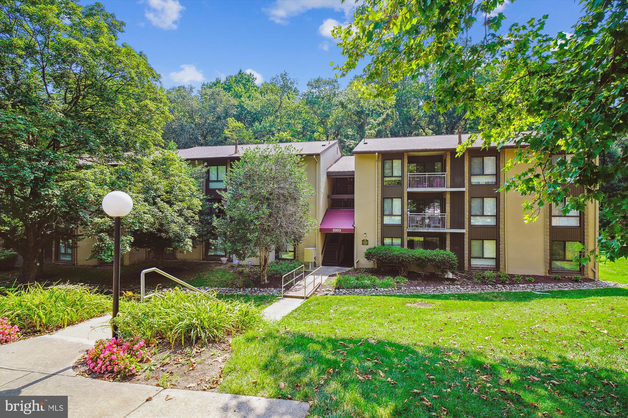 Awesome location. 'Like living above the woods in this Mid-level Condo. Kitchen and flooring were updated in 2020. Gas and water are included in the condo fee (Gas Stove and Gas Heat). Two Walk-In Closets in the primary bedroom. Balcony off living room, dining room off Kitchen and Second bedroom all have views of the woods in back of the building, too. Laundry is separate on the ground floor in a shared laundry room for residents of this building only. Condo management is onsite not far from this property. A stream winds through this condominium with walking paths with bridges . Close to restaurants, shopping, commuter routes and all that Columbia and Howard County have to offer. Jeffers Hill Pool one block away. Ballfields, lakes and parks nearby. Two sets of stairs, one down to the building entrance and another up to the middle floor to the condo itself. Know before you go that parking is by permit only in this condominium. They have a 24/7 towing service and a code is needed to enter the parking lot. Once you enter, parking is marked clearly and assigned. Even in the guest parking spaces, a guest pass is required to be hanging in the car or you risk being towed. Appointments are required and all agents and potential buyers must follow showing instructions to avoid the cost of recovering towed vehicles.