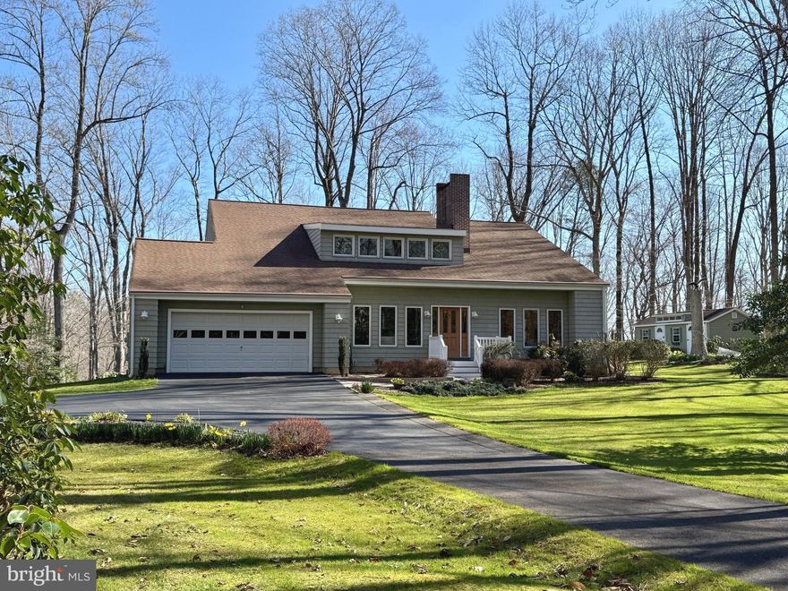 Welcome home to this meticulously cared-for sprawling contemporary on a 5-acre secluded, beautifully landscaped lot. This home boasts approximately 3,400 sq. ft. across the main two levels, with a full, unfinished basement waiting for you to make it your own. Enjoy cozy evenings by the double-sided fireplace or marvel at the soaring vaulted ceilings in the family room. The gourmet kitchen features a gas cooktop, granite countertops, and updated appliances.

Relax in the spacious Florida room or entertain guests in the large dining room, which opens to a deck overlooking the trees and leads to the fire pit area.  Family room with full-height windows to allow extensive natural light. Upstairs, you'll find four generously sized bedrooms. The master suite offers two walk-in closets and a luxurious master bath with an oversized shower and jetted tub.

The home also features vinyl cedar shake siding, a two-car garage, and a large shed for additional storage, providing both style and convenience. It also has a whole-house water filter/ conditioner and a security system. 

The neighborhood offers fantastic amenities, including a community pier, boat ramp, and picnic area — perfect for enjoying the outdoors and water activities.

This home has been meticulously taken care of, ensuring it’s move-in ready for its new owners.