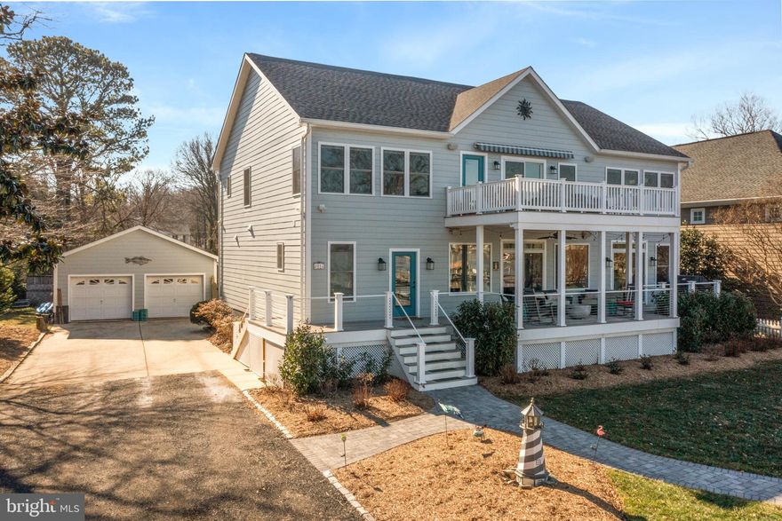 Incredible waterfront opportunity awaits in this stunning home in West River! Located on a private road in the Back Bay Beach community, this property checks a lot of boxes. The water views are exceptional -across the wide and scenic West River and out towards the Bay. The 300' private pier has two boat lifts, two jet ski lifts, and a guest slip. The house was totally rebuilt and completed in 2019. Features of the home include: Hardiplank exterior siding, a two-car oversized detached garage, 9' ceilings on main level of house. The home’s open floor plan was planned for waterfront living and enjoyment. Lots of windows and sliders on water side open to a large, covered porch that extends your living space and makes this a great entertaining home or just enjoying with family and friends. Other features: a kitchen any chef will be delighted with is here! It has a 6 burner Viking gas range, upgraded Electrolux SS fridge, dishwasher, wall oven & microwave, granite counters, kitchen island with breakfast bar, custom cabinetry. There is a walk-in pantry and laundry room off the kitchen, and a conveniently located powder room. The open living area affords plenty of room for large dining table, family room area with corner gas fireplace, and an awesome custom bar with leathered granite top, built in ice maker, fridge, and wine fridge. There is also flex space that can be whatever you need (currently occupied by a pool table). An en suite guest room is also located on this main level.
The Upper level was well planned by current owners. At the top of the stairway the spacious landing area is currently used as a home office and has its own exceptional water views and doorway to upper-level waterside deck. The Primary bedroom overlooking the water has plenty of space for a sitting area, workout area, and has a lovely spa like bath and walk in closet. 3 more bedrooms on this level (one is en suite...the other two share a full bath off the hall). A 2nd laundry room on this upper level.
Other feature include surround sound on the main level and the covered waterside porch area; fire suppression system (county code for rebuild).  No mandatory HOA. There is a boat ramp around the corner that can be used by residents. 
Flood insurance not required as per FEMA map amendment determination (structure was removed from the SFHA)
Proximity to  the DC and VA  area is approximately 45 minutes; and to downtown Annapolis and the Naval Academy about 30 minutes.