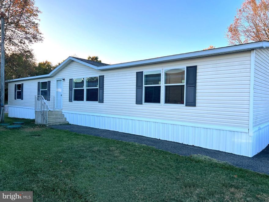 BACK ON MARKET DUE TO NO FAULT OF THE SELLERS!  Price Reduced!!!  Discover one of the largest homes in Forest View Village! This rarely available 4-bedroom, 2 full bathroom double-wide manufactured home, built in 2012, offers an impressive 1,872 square feet of living space. With a BRAND NEW roof (installed September 2024), this home is move-in ready for those who need space, comfort, and convenience.

Step inside to a bright open-concept living area featuring vaulted ceilings and an abundance of natural light. The spacious eat-in kitchen, complete with an island, is perfect for hosting family meals or gatherings. Just steps away, the conveniently located laundry room makes everyday chores a breeze. It also provides extra storage space and access to the rear yard.  Enjoy a versatile bonus area just off the kitchen—great for a kids' play area or even an additional  lounge spot for casual entertainment.

The primary bedroom boasts an expansive ensuite bathroom, freshly painted for a nice, neutral feel. You'll love the HUGE walk-in closet, offering more than enough room for your wardrobe and storage needs. In fact, the storage throughout this home is fantastic—all bedrooms are generously sized and feature ample closet space, making this home perfect for large families or anyone needing lots of room to organize.

Outside, a small shed provides additional storage, perfect for outdoor equipment or seasonal items. The home is also ideally located, close to shopping and major highways for easy access to daily conveniences.

The ground rent covers trash, water, sewer, Maryland tax, flush tax, and snow removal, offering peace of mind and simplified living. (All potential buyers must be approved by the park.)

Hurry up and don't miss out on this rare 4 bedroom find—schedule a showing today to experience one of the largest homes in Forest View Village!