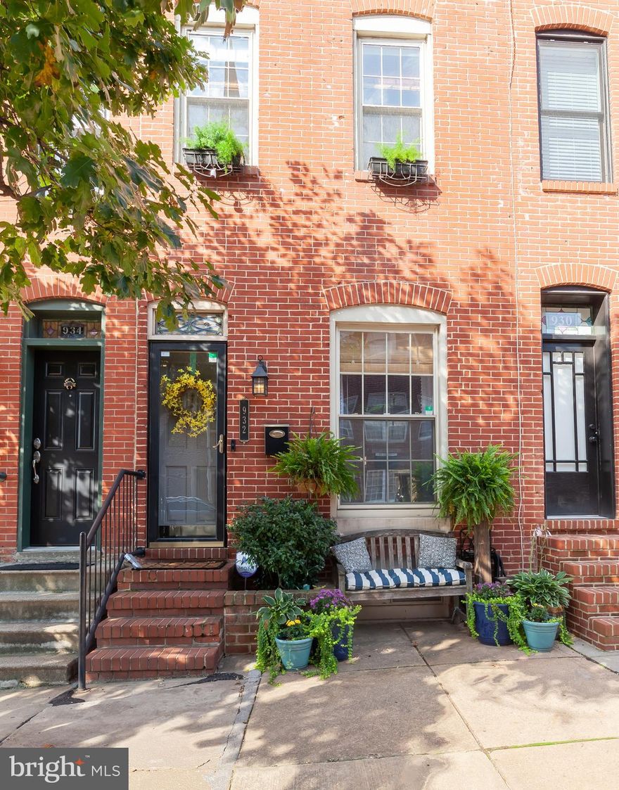 Magnificent home with over 3000+sq  ft finished living space.This home features gourmet kit w/ ss appliances,custom cabinets w/built-ins & custom lighting.Finished lower level with half bath & laundry area.Exposed brick on all levels,sep dining area, decorative fireplace,hardwood flooring &home audio system included.Stunning roof top deck with a beautiful view& private patio.A must see!!!