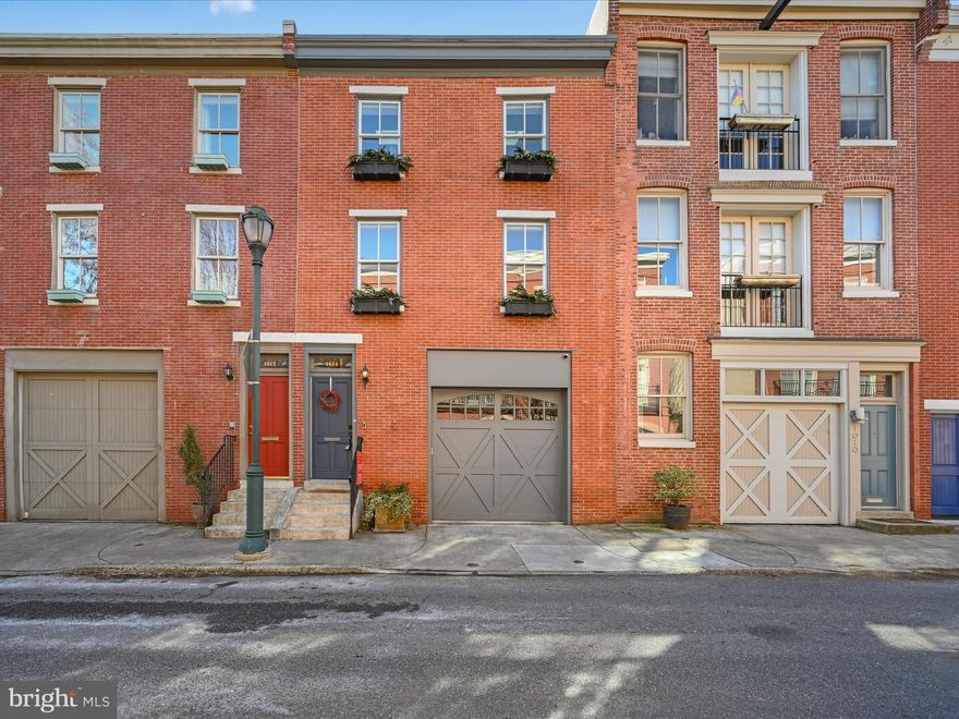 Exquisite 20' ft wide Carriage house with GARAGE PARKING on a very desirable block in the Art Museum Area. This impeccably maintained 3600 Sq ft home features.....Oak hardwood floors through-out, dual-zoned HVAC, wainscoting, crown moldings, recessed lighting, built-in speaker system, Ring video doorbell and outdoor audio/video Nest security system, dramatic high ceilings, ample closet space throughout and attached garage with inside access. Main Floor: Open layout...Foyer leads to cozy living area, dining room, powder room, sun-drenched gourmet kitchen with adjoined south facing backyard and patio, and new S/S appliances (including top-of-the-line duel-fuel Dacor range), tiled backsplash, granite countertops, custom Kraftmaid cabinetry w/under cabinet lighting, oversized center island w/pendant lights and access to a private bluestone patio and garden. 2nd Floor: Formal living room w/gas fireplace and built-in book shelves and wet bar, office/study, full bath and bedroom with custom closets. 3rd Floor: Master bedroom w/ walk-in custom built closet, gas fireplace, luxurious designer bath w/heated floor, huge Victoria + Albert soaking tub, double vanity and walk in shower w/frameless glass door, laundry room and additional bedroom with ensuite bath and custom closets. Stairs lead to pilot house w/access to the immense Trex rooftop deck with built-in seating and stunning views of the city skyline. Conveniently located close to many great restaurants, parks, the Broad Street subway line and all that Center City has to offer.......