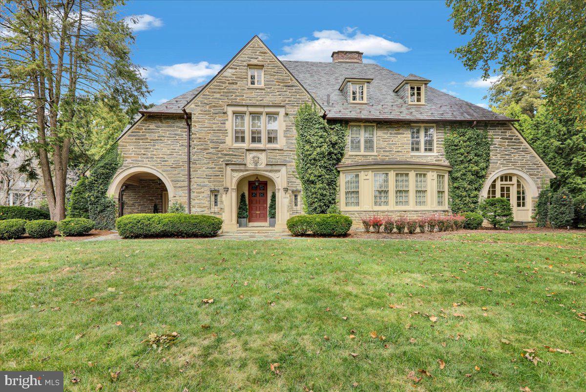 Architectural Castle Stone Mansion in the Heart of Wyomissing --
Step into one of Wyomissing’s original architectural gems — a storied castle stone manor at one of the community’s most coveted addresses. With breathtaking stonework and an unmistakable silhouette, this residence stands as a landmark admired by all, with every detail curated for a lifestyle of distinction.
Greet guests in a grand foyer with high ceilings, elegant hardwood floors, and an iron stair railing — a proper introduction to the home’s enduring beauty enhanced by estate-quality improvements throughout.
Entertain in unmistakable style in the Williamsburg-inspired dining room with Thomas Jefferson duplicate built-ins, or delight in the award-winning, epicurean kitchen, featuring a central island, breakfast bar, trey ceiling, dramatic moldings, and a sunlit breakfast room overlooking serene back gardens.
Bathed in natural sunlight, the inviting sunroom offers sweeping views of the gardens, while the richly paneled den, with original wood ceilings, custom built-ins, and a grand wood-burning fireplace, serves as both a regal retreat and refined gathering place for honored guests.
Upstairs, discover a master suite sanctuary with a dressing room of custom organizers, a spa-like bath with Whirlpool tub, waterfall faucet, rain shower, and striking marble counters. Secondary bedrooms offer their own character and comforts with dual closets, built-ins, and angled ceilings, while supplemental heat in every bathroom, a second-story sixth bedroom/multi-purpose room, floored attic, and large laundry blend convenience with luxury.
Masterfully reimagined to surpass every expectation of luxury and entertainment, the lower level unveils a spectacular family suite with stunning, custom Schubert built-ins, a designer wet bar, cleverly concealed office, and a gym featuring mirrored ceilings. A full tiled bath and additional laundry bring effortless convenience, making both special gatherings and casual evenings feel truly legendary.
This home stands as a testament to legacy and hospitality at the highest level. This is more than an opportunity; it’s an invitation to steward a landmark of Wyomissing — where your family’s memories become woven into the fabric of local history.