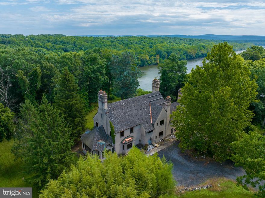 " Sarnia", Potomac Riverfront property 12.65 acres, beautiful river views up and down river. Sited on a limestone cliff on the rivers edge , shell dwelling ( Create your Fantasy Castle),  5, 918 Sq ft. Built 1930 +/- periodic  improvements . Look of a rural manor home 1600s French Provincial.   ( floor plans in documents). The owner periodically renovated  structure,  including some modern interior farming and rough mechanics.  The interior of the structure is partitioned with wood  framing but remains unfinished. Framing includes a large foyer on the first floor, with a single large room to the left and two partitioned rooms to the right.  A third  partitioned room is accessible from the front room to the right of the foyer.  The second floor  appears to be partitioned into 4 bedrooms  and each of these bedrooms appears to contain  a private  bathroom.  The primary staircase extends to the third floor which contains roughly half the living area of the level below.  It is partitioned into two bedrooms each with a private bath.  There are no finished walls or ceilings.  Rough electricity in most rooms.  No plumbing present.  10 rooms, 6 bedrooms, 6 baths. The property Includes a two story 5 room  guest cottage 1,229 Sq. ft., constructed 1992+/- not completed interior; two bedrooms, 1.5 baths.                                                                                                                                                                                                                                                                                                                                                                                                                                                                                                                                                                                                                                                                                                                                                                                                                                                                                                                                                                                                                                                                                                                                                                                                                                                                                                                                                                                                                                                                                                                                                                                                                                                                                                                                                                            There are 5 parcels of land;  9-8-41, 0.37 acres, 9-8-441, 4.00 acres, 10-1-89, 6.40 acres, 10-1-90, 0.918 acres,10-191, 0.9861 acres .  Two  Parcels are  riverfront, 89 and 91, form the northern boundary and provide good elevated views of the Potomac River.  Parcels 89,90, 91 were annexed into the town limits of Shepherdstown in 2019 . Two parcels are Jefferson County 
The property fronts E German Street/ River Road  for access. 
 Any subdivision of the subject property would be subject to either local ordinances within the town of Shepherdstown or the Jefferson County Subdivision Ordinance.                                                                                                                                 

Public water, sewer to the site.  Highest, best use.   Potential for high density residential development,  mixed density residential development.   
Buyer to perform  due diligence.