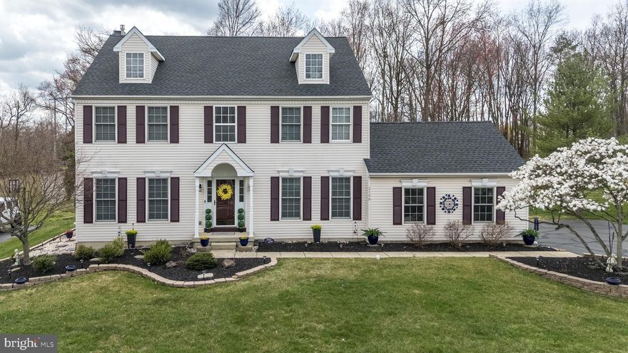 Welcome home to this meticulously maintained 4-bedroom, 2.5-bath single-family home in the desirable Montgomery Hollow neighborhood! Step inside to find new hardwood floors throughout the first level, creating a warm and inviting atmosphere. The updated kitchen is a chef’s dream, featuring granite countertops, stainless steel appliances, a large island, subway tile backsplash, and recessed lighting—all open to a spacious, sunny family room with a cozy wood-burning fireplace flanked by windows.  The main level also boasts gracious living and dining rooms with elegant crown molding and beautiful silhouette blinds, perfect for entertaining. Upstairs, enjoy brand-new carpeting and a luxurious primary suite with vaulted ceilings, two walk-in closets, and a refreshed en-suite bath with double sinks, new lighting, and new flooring. Three additional generously sized bedrooms with ample closet space complete the second floor. The finished basement offers even more living space, abundant storage, and great lighting—plus a pool table is included!  Step outside through the sliding door off the family room to a spacious composite deck, overlooking a half-acre, flat backyard with a backdrop of mature trees—an ideal setting for outdoor enjoyment. Recent updates include a newer HVAC system and a newer water heater.  The roof was installed in 2021 for peace of mind. This home is nestled in a walkable neighborhood close to parks, offering both convenience and a sense of community. Don’t miss out on this incredible home—schedule your showing today!