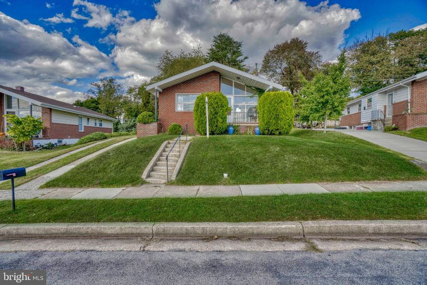 BEAUTIFUL, LIGHT-FILLED, BRICK RANCHER BOASTS BRIGHT, OPEN LIVING ROOM WITH SOARING VAULTED CEILING AND REFINISHED HARDWOOD FLOORS IN LIVING ROOM AND SEPARATE FORMAL DINING ROOM. KITCHEN WITH BRAND NEW STAINLESS STEEL REFRIGERATOR, WALL OVEN, COOKTOP AND DISHWASHER! 3 MAIN LEVEL BEDROOMS ALL WITH BRAND NEW CARPET.  PRIMARY BEDROOM WITH HALF BATH. ENTIRE MAIN LEVEL HAS BEEN FRESHLY PAINTED. MANSIVE BASEMENT CLUB ROOM WITH NEW HALF BATHROOM! *FIREPLACE AS-IS.  LARGE LAUNDRY AND STORAGE ROOM TOO. CONVENIENT EXTRA LONG DRIVEWAY AND SIDE ENTRANCE.  PLUS NEW ROOF AND NEW AC! WELCOME HOME TO CHARMING CARNEY NEIGHBORHOOD!