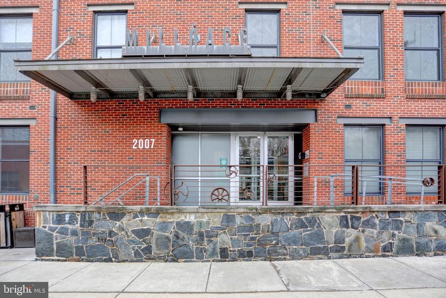 Don't miss this upgraded 2 bedroom, 2 bath condo with parking in sought-after Millrace. Features an open living & dining area, kitchen with new stainless steel appliances & quartz countertop, new sink and faucet in 2020. Primary bedroom with walk-in closet and en-suite bath. Additional features include manufactured hardwood throughout, crown moulding, custom blinds, recessed lighting.  Utility closet with stackable washer and dryer.  Community pool, deeded Garage parking.  Located across the street from Woodberry Kitchen, and Gutierrez Memorial firepit, walk to zen garden, La Cuchara, Blue Pit BBQ, Artifact Coffee, Waverly & Union Brewery.  Convenient to the Light Rail, I-83 and walking distance to The Avenue in Hampden.