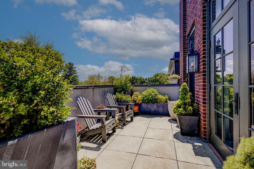 On the fourth floor of Chestnut Hill's premier building, One West, this sophisticated two-bedroom plus den, and three-bathroom residence offers unmatched elegance and comfort across its expansive over 2,000 sqft layout. The heart of this home is a generously sized living room, with direct access through French doors to a  professionally landscaped private balcony with an irrigation system that runs the full length of the unit. From here, enjoy breathtaking views of the Philadelphia skyline over the canopy of Fairmount Park. 

Back inside, culinary enthusiasts will appreciate the kitchen's abundant Cherry cabinets and quartz countertop space, creating an ideal environment for both casual meals and formal entertaining. The kitchen is also equipped with a coffee station that has built-in shelving, and a convenient pantry with prep sink, plus a laundry unit and storage, making it the  powerhouse of the home. The tranquil primary suite is a true retreat, featuring a vast dressing room with custom built-in cabinetry fitted by California Closets and a spacious bathroom complete with a spa-like shower and a separate soaking tub. The private guest suite offers French doors that open to the terrace, seamlessly blending indoor comfort with outdoor relaxation. The study is a great all-purpose space that can be transformed into whatever your heart desires. Parking is a breeze with the secure covered garage with two parking spaces and additional storage unit for added convenience.

One West’s exterior exudes timeless elegance with its brick facade, Pennsylvania bluestone, and native Wissahickon schist, paying tribute to the neighborhood's rich architectural legacy. Positioned in the vibrant local dining and shopping area along The Avenue, and the proximity to the endless footpaths of the Wissahickon Valley, this location is truly unmatched. Seize the opportunity to make One West your new home and live perched above Philadelphia’s Garden District. Book your private viewing today and discover the pinnacle of Chestnut Hill living.

**4 years remaining on the unit’s tax abatement